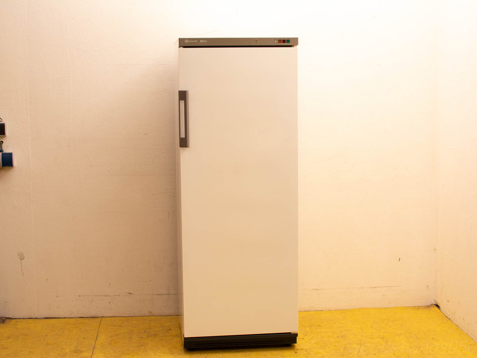 Sleek white refrigerator with minimalist design, perfect for contemporary kitchens and stylish interiors.