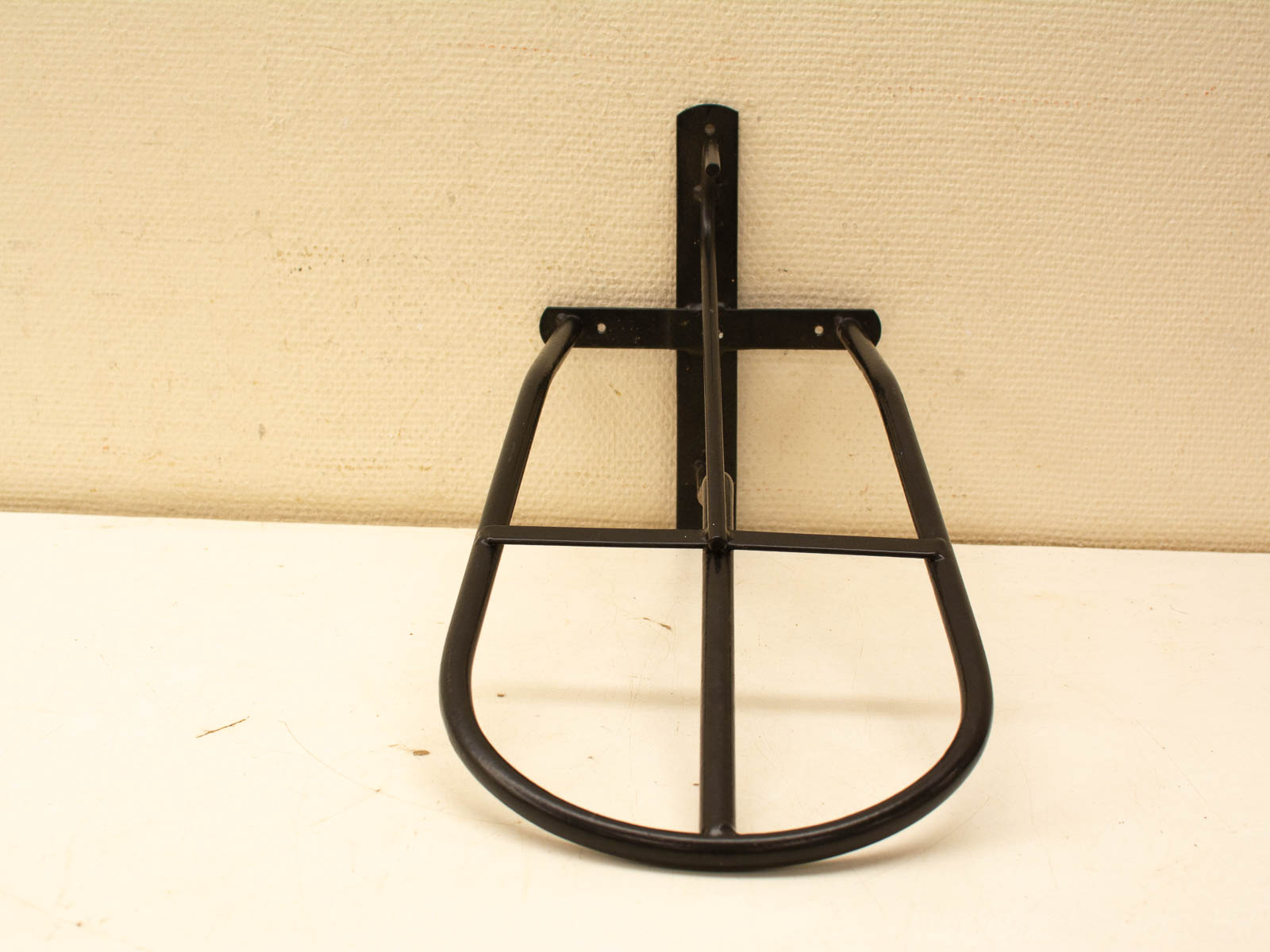 Sturdy matte black bicycle rack for secure everyday carrying of groceries and bags.