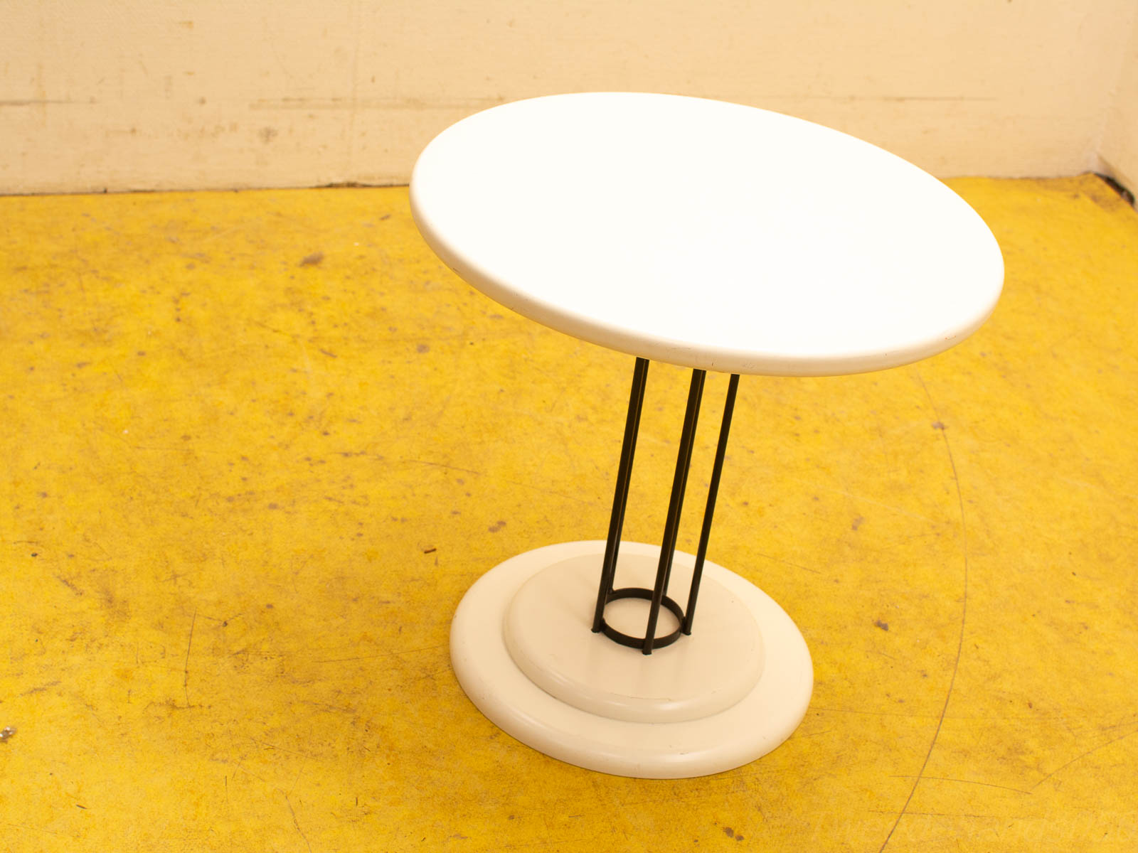 Sleek white and black minimalist table with geometric design, perfect for stylish modern spaces.