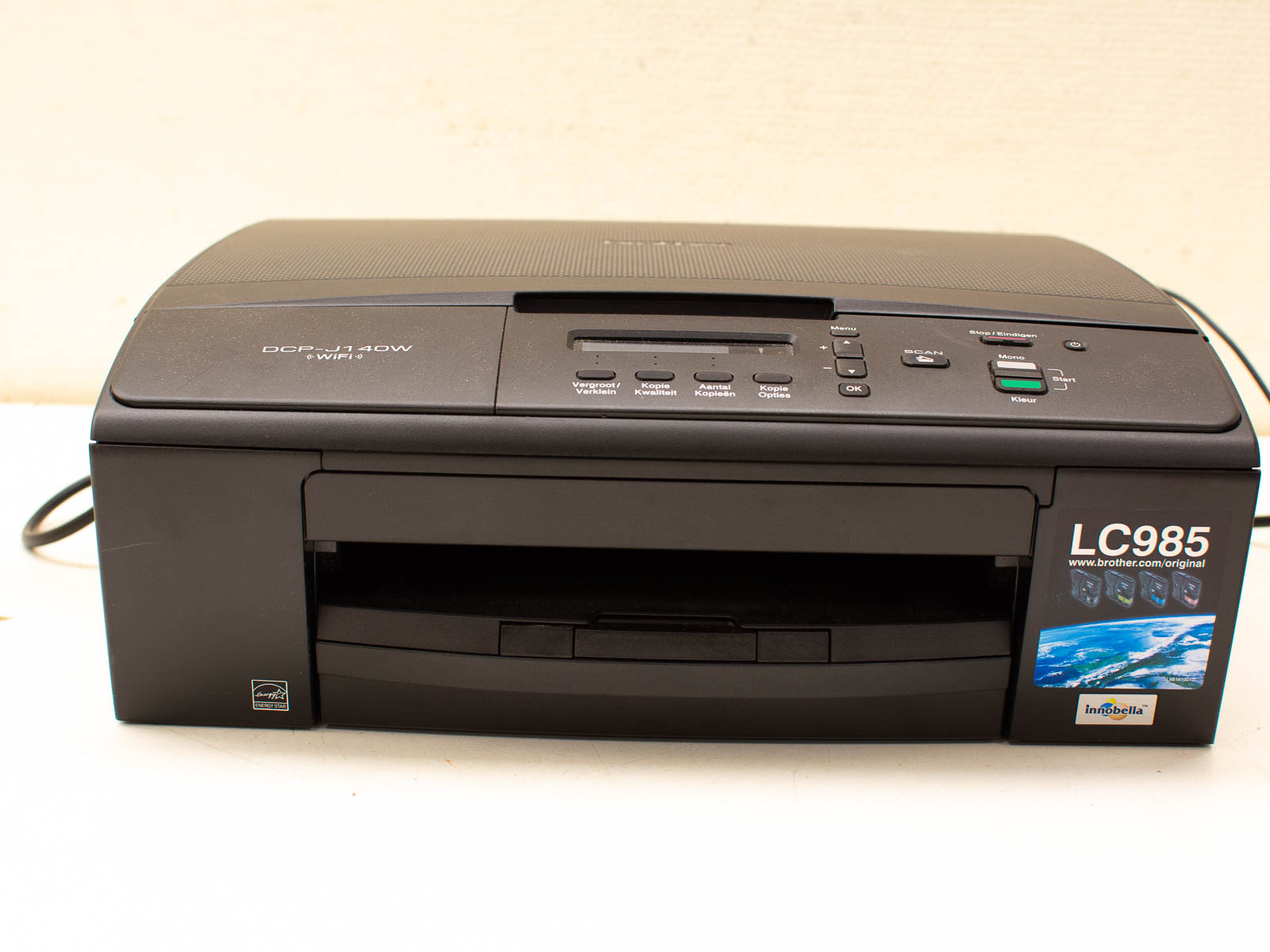 Compact Brother DCP-J140W wireless multifunction printer for seamless printing, scanning, and copying.