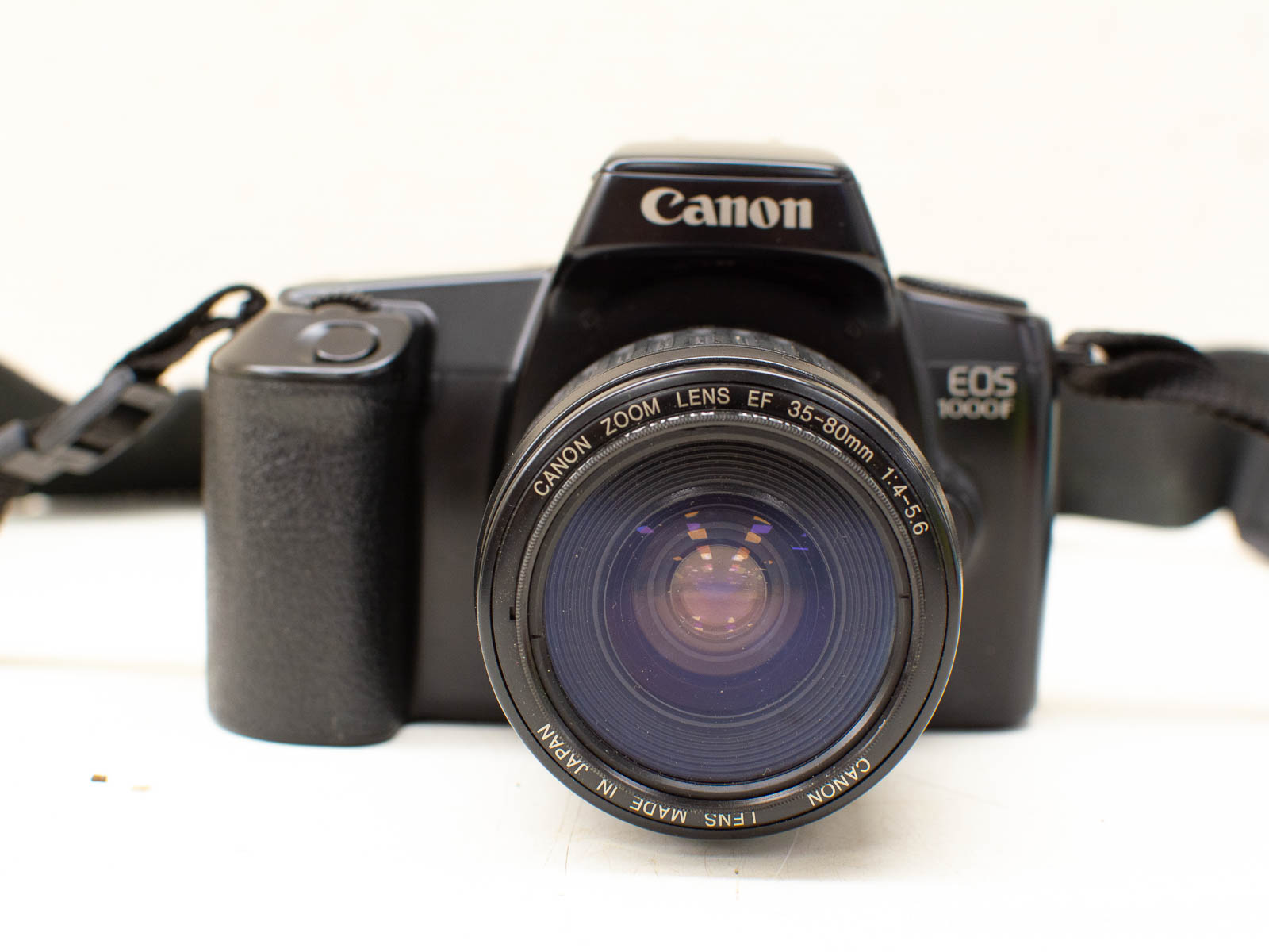 Canon EOS 1000F vintage film camera with versatile 35-80mm zoom lens for creative photography.