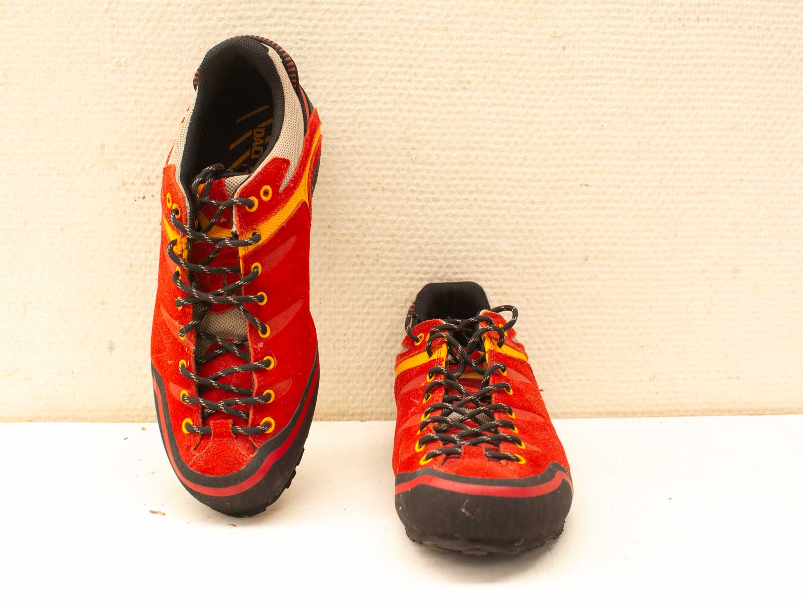 High-quality red and yellow climbing shoes for sale, perfect for serious climbers.