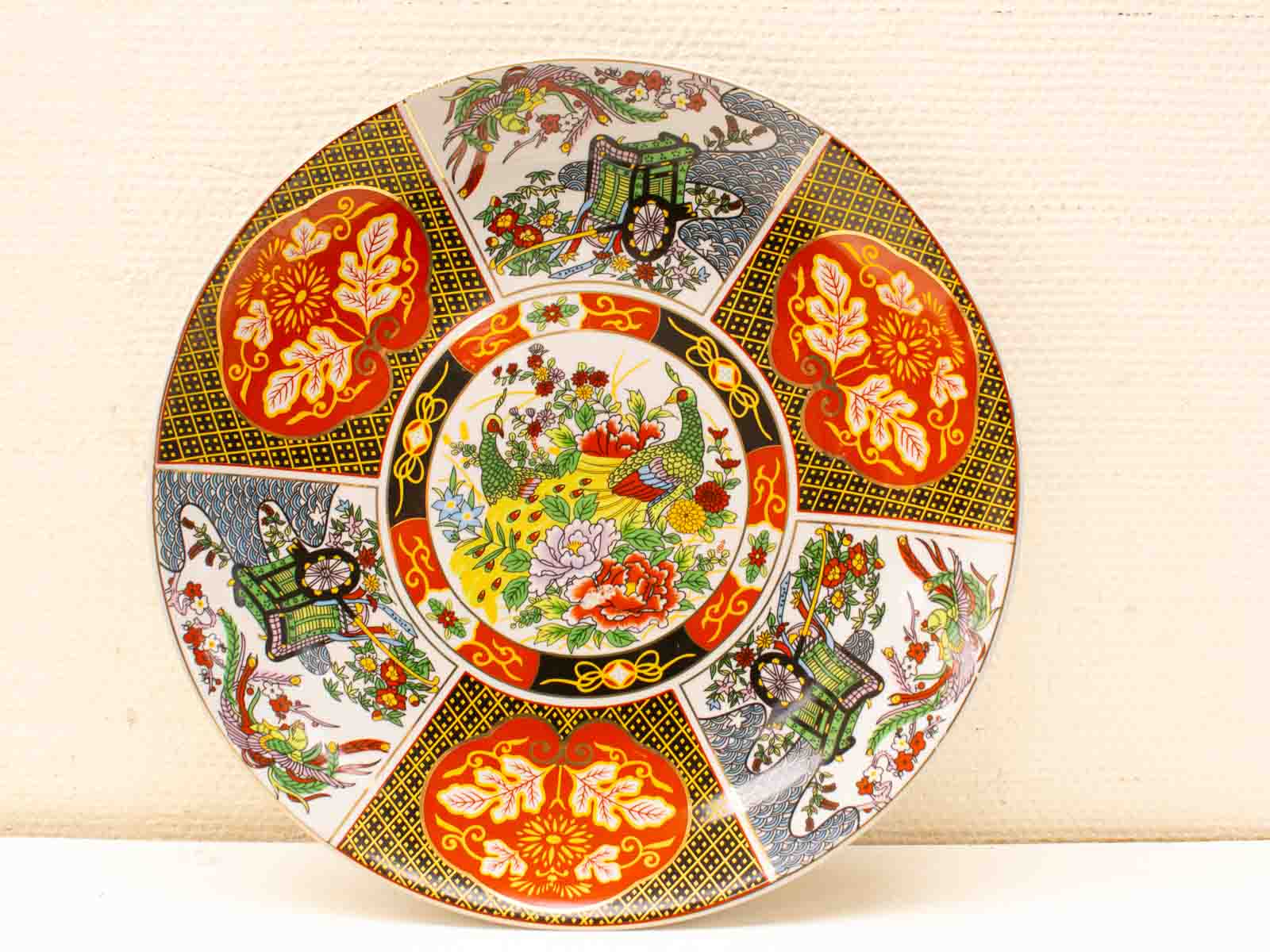 Vibrant ceramic plate with intricate floral designs, perfect for home decor or as a collectible.