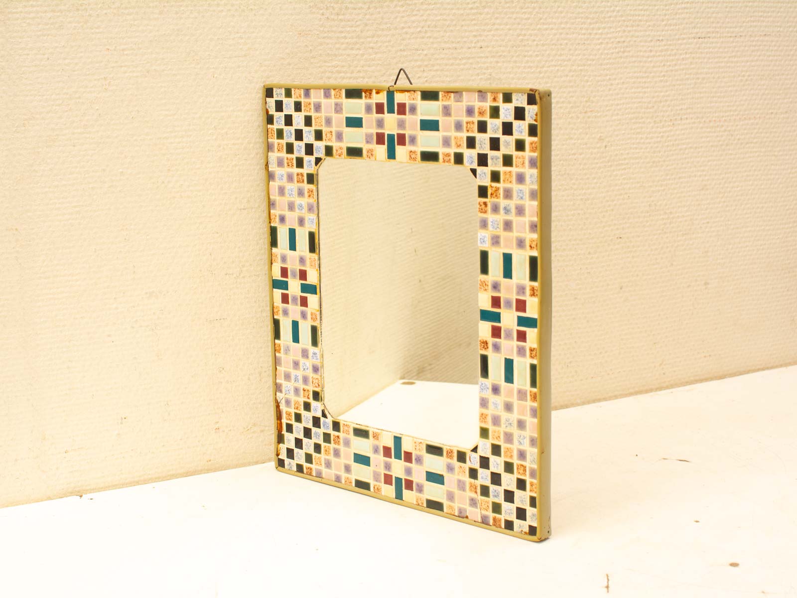 Vibrant mosaic mirror with colorful tile frame, perfect for enhancing your home decor.