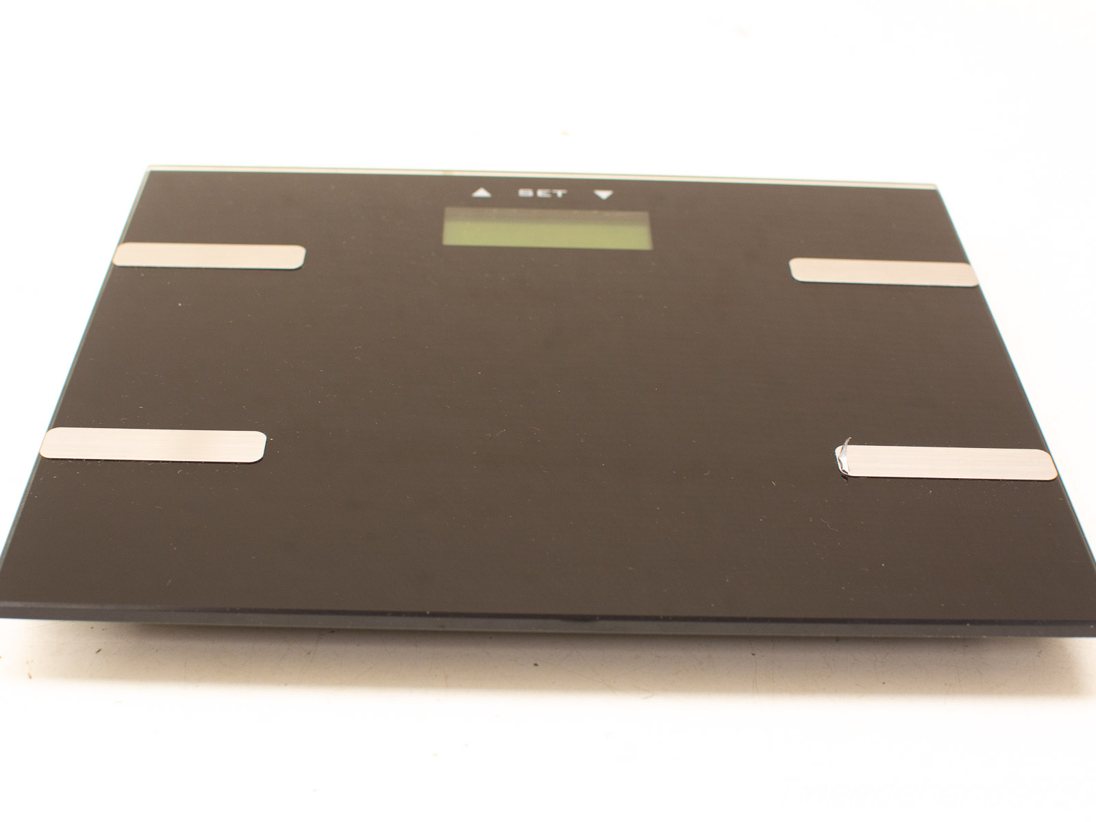 Sleek black digital scale for personal health tracking with a modern design and user-friendly interface.