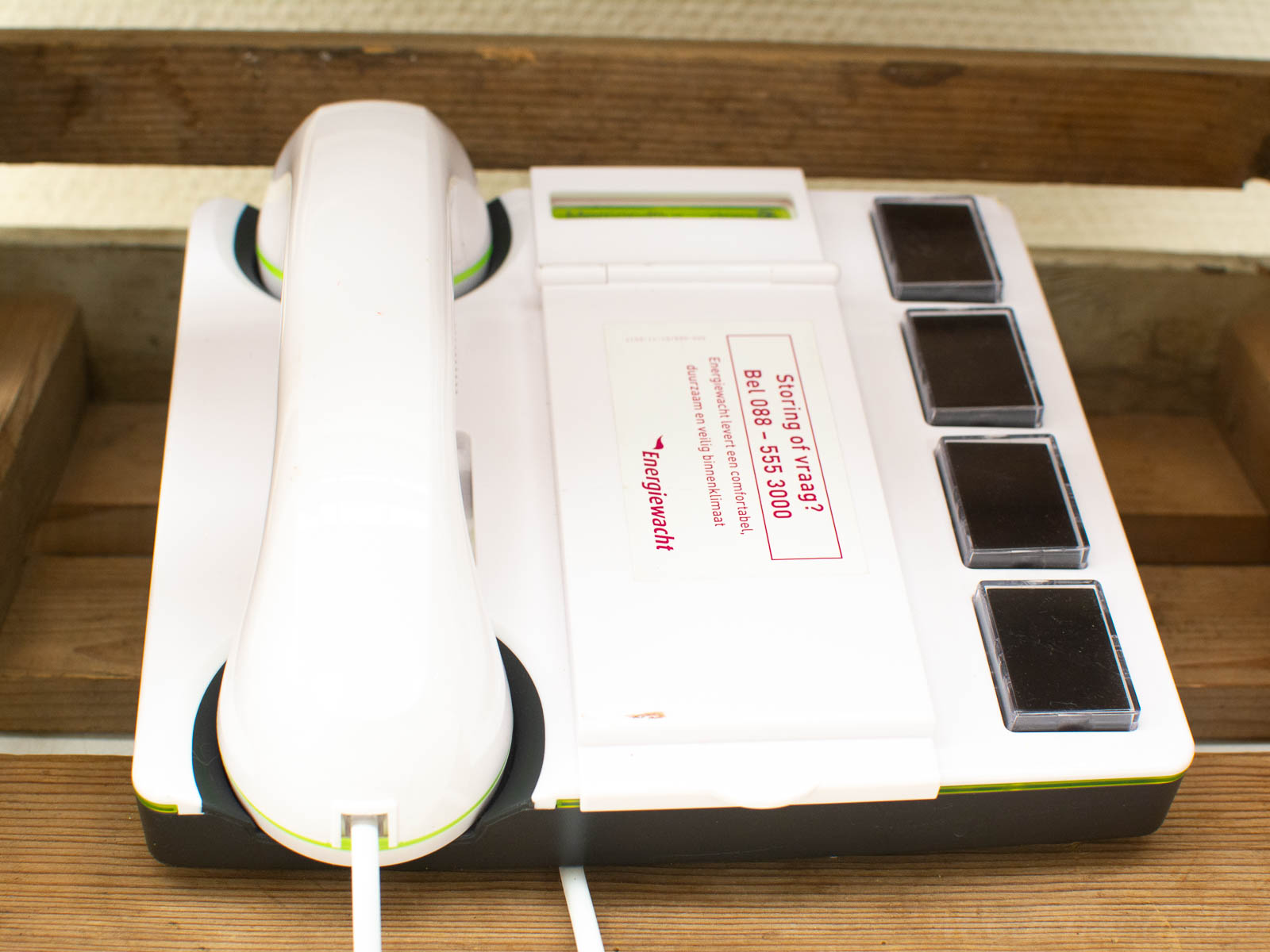 Nostalgic white and green telephone with user-friendly controls and service instructions.