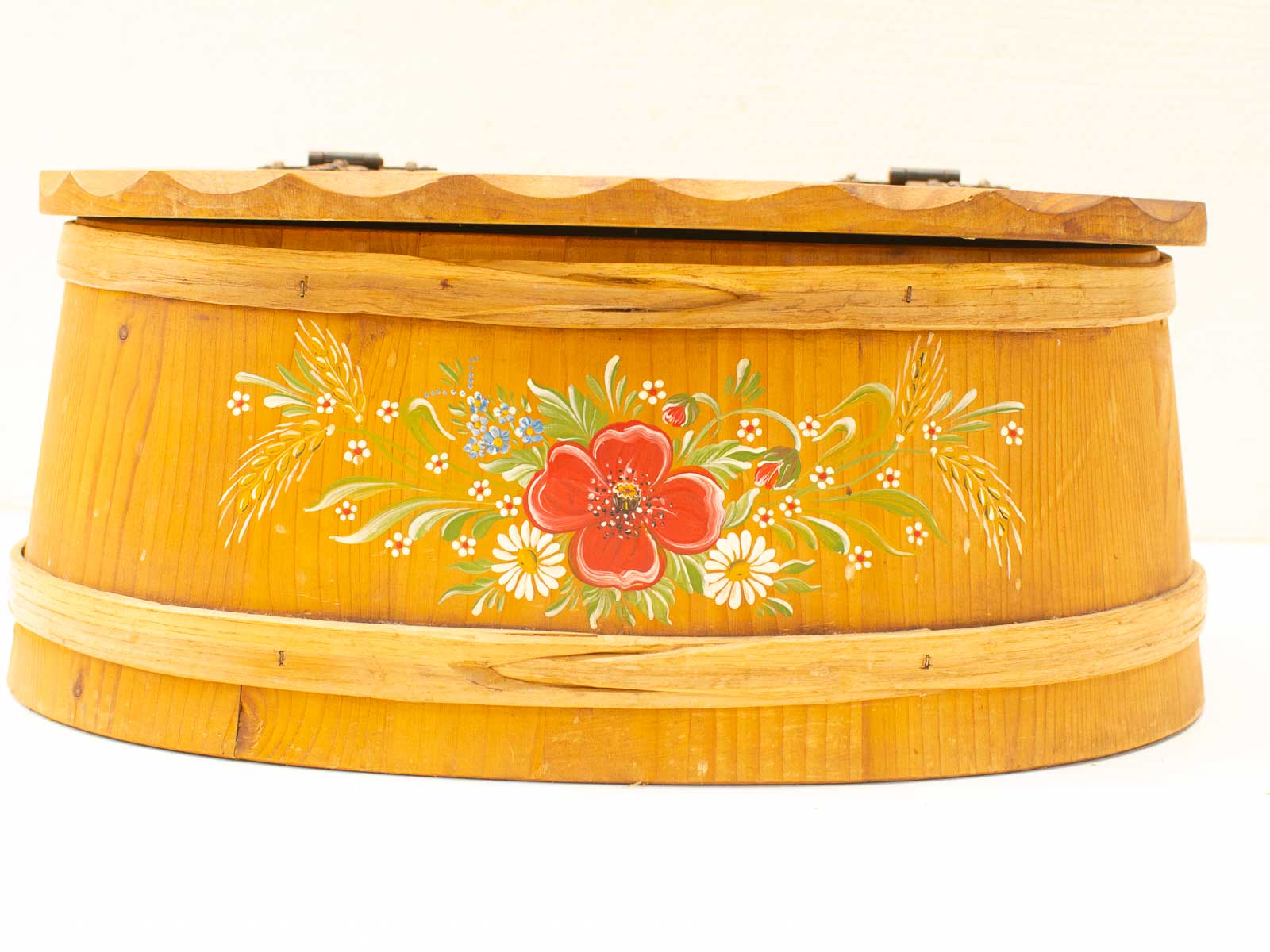 Handcrafted light-wood storage box with vibrant floral design, combining functionality and artisanal beauty.