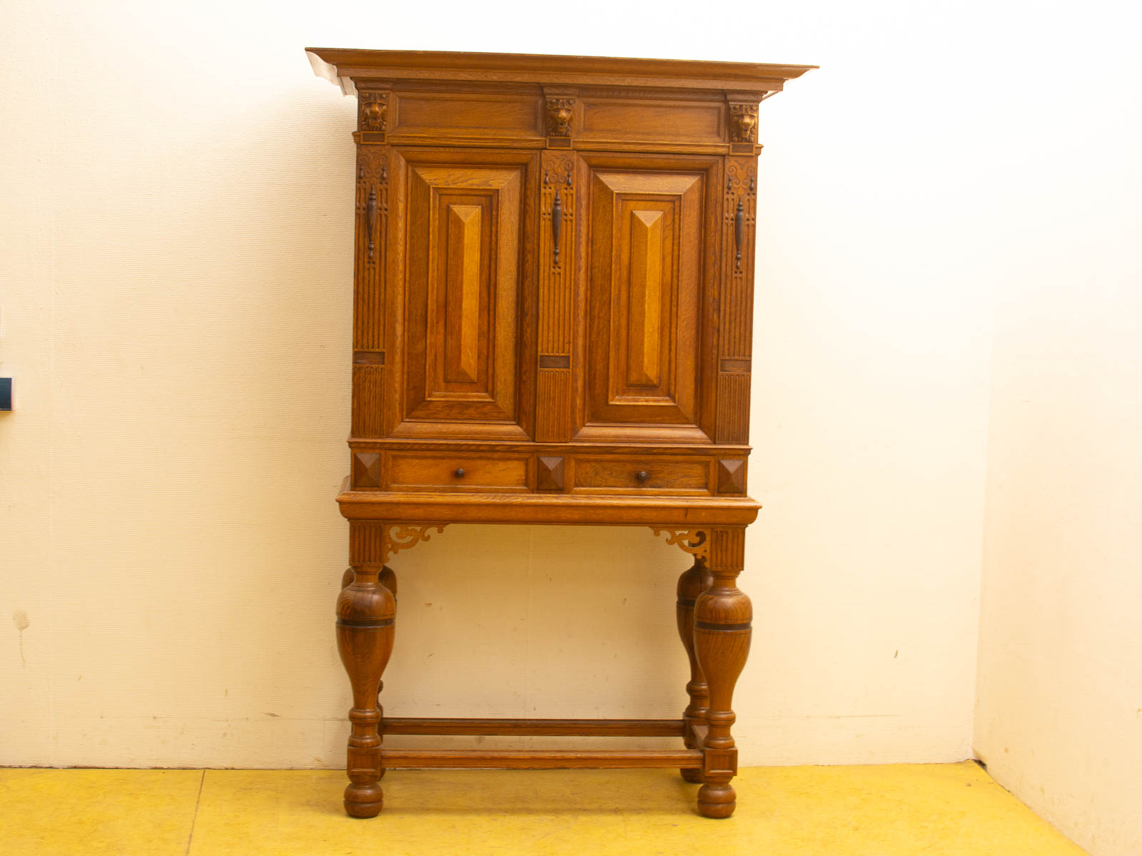 Vintage oak cabinet with intricate geometric design, an elegant addition to any interior style.