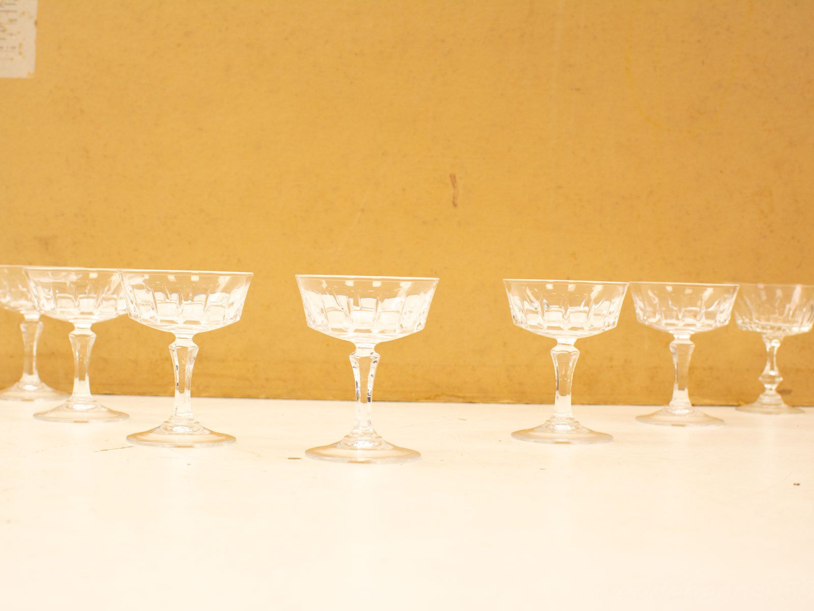 Elegant crystal coupe glasses for festive toasts and cherished celebrations with loved ones.