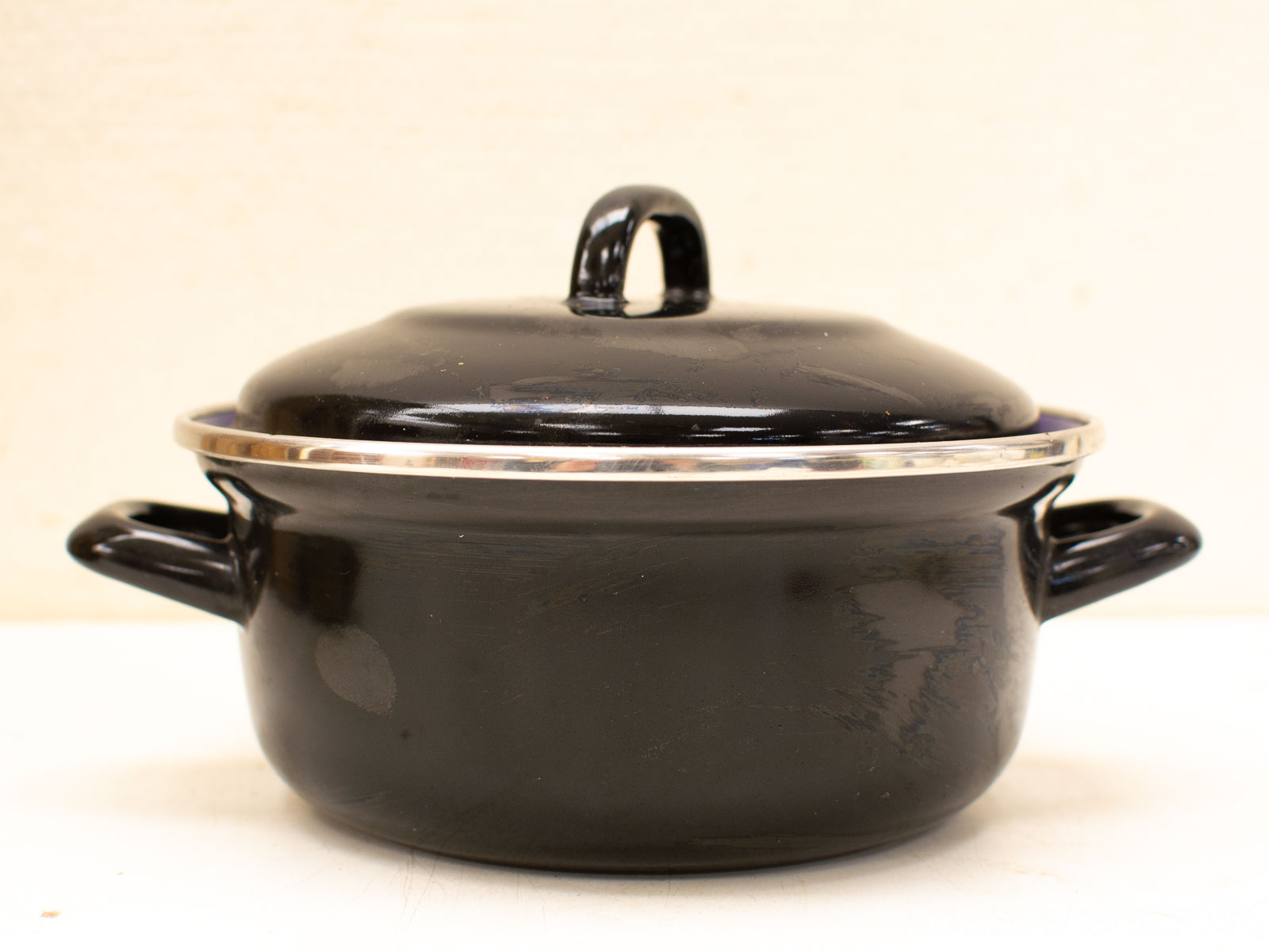 Elegant Glossy Black Cooking Pot with Silver Rim and Sturdy Handles