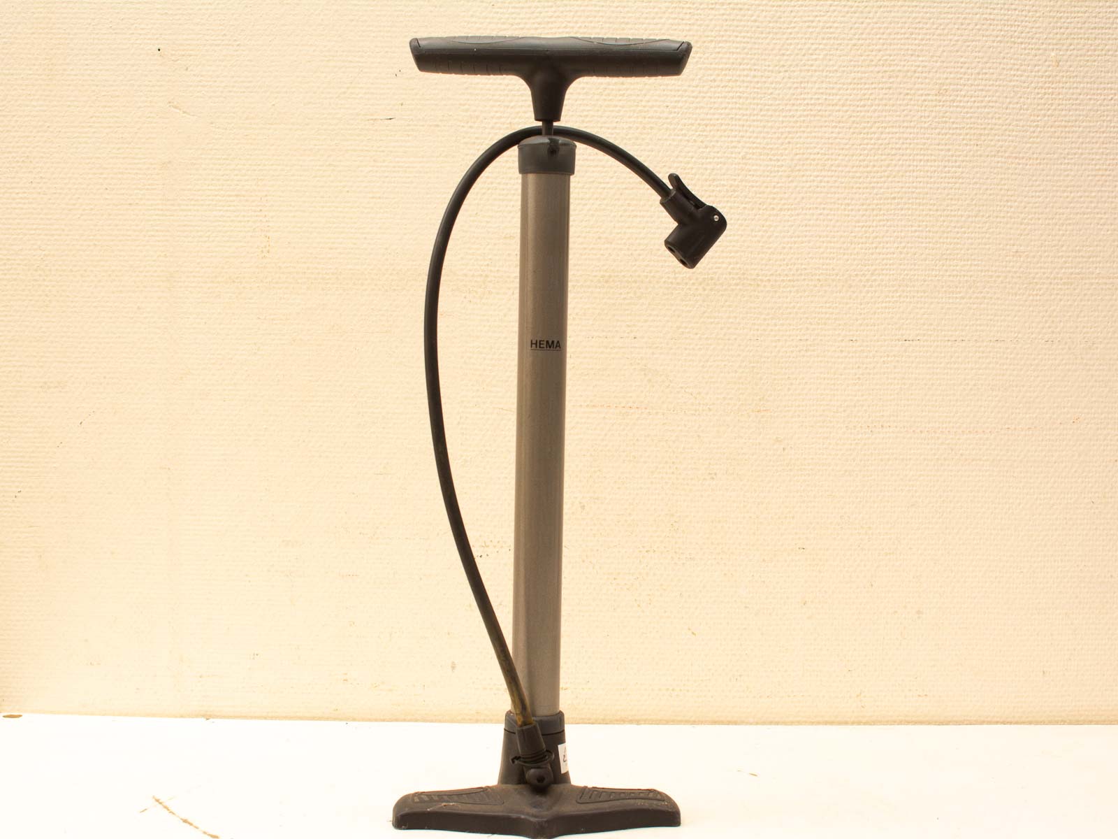 Vintage aluminum bicycle pump with ergonomic handle, perfect for easy tire inflation.