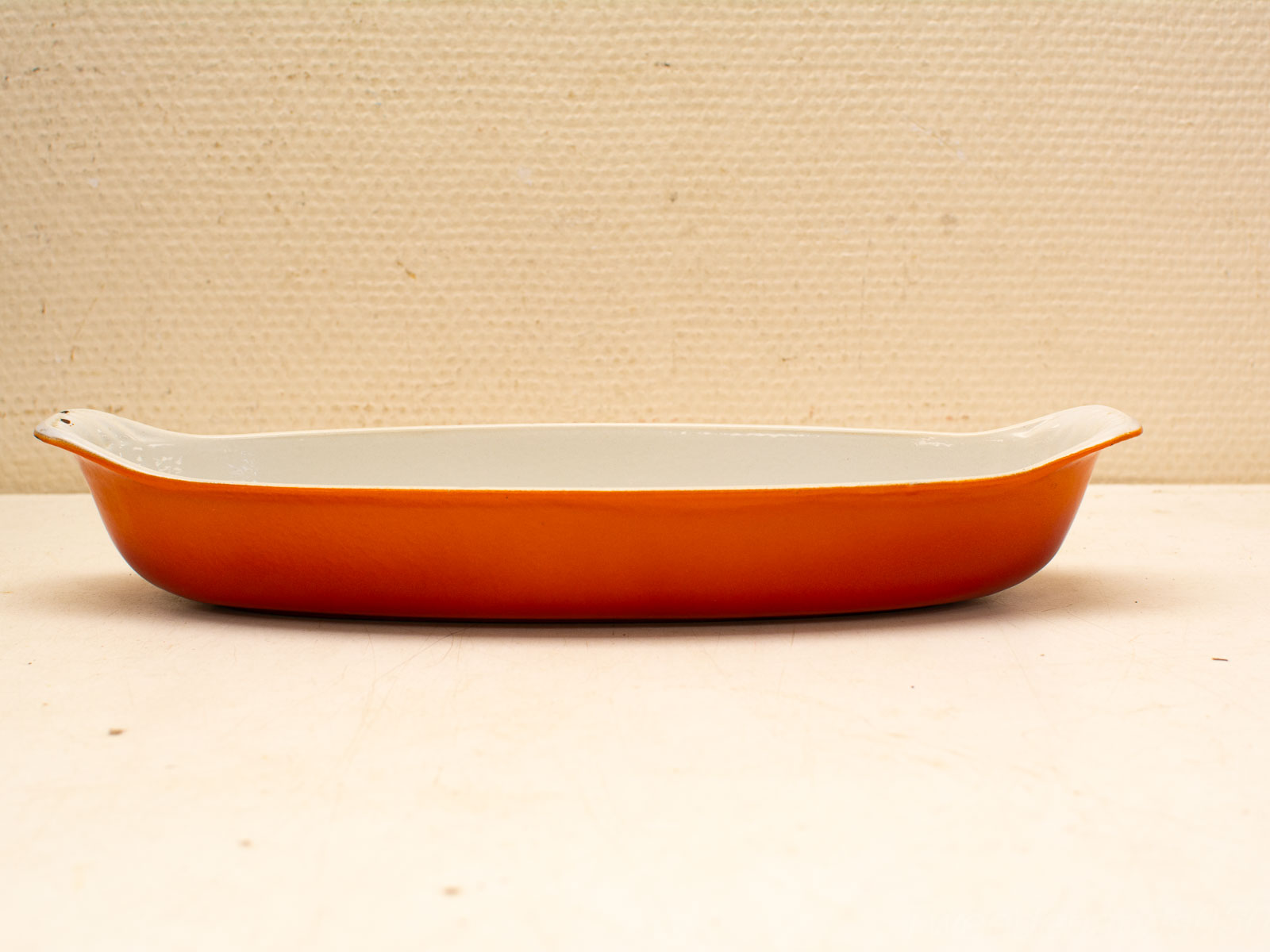 Vibrant Orange Ceramic Baking Dish with Cream Interior for Versatile Cooking and Elegant Serving