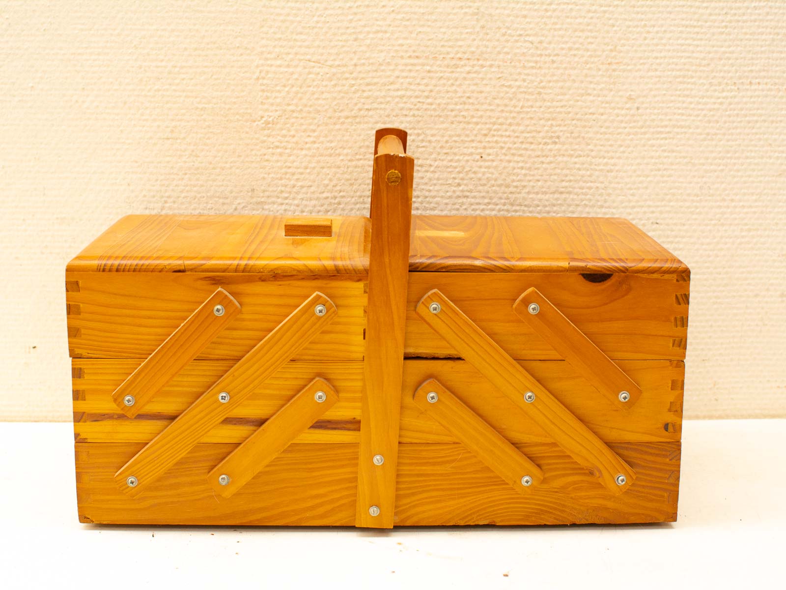 Handcrafted pine wood box showcasing rustic charm and industrial design elements.