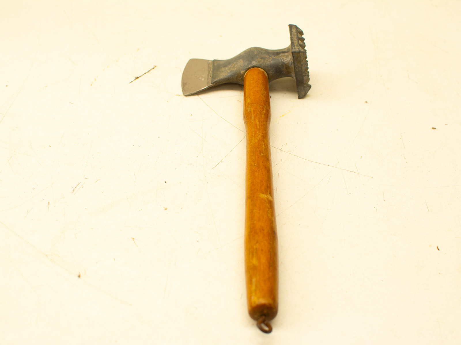 Versatile hammer-tool with sharp edge, perfect for furniture makers and woodworking projects.