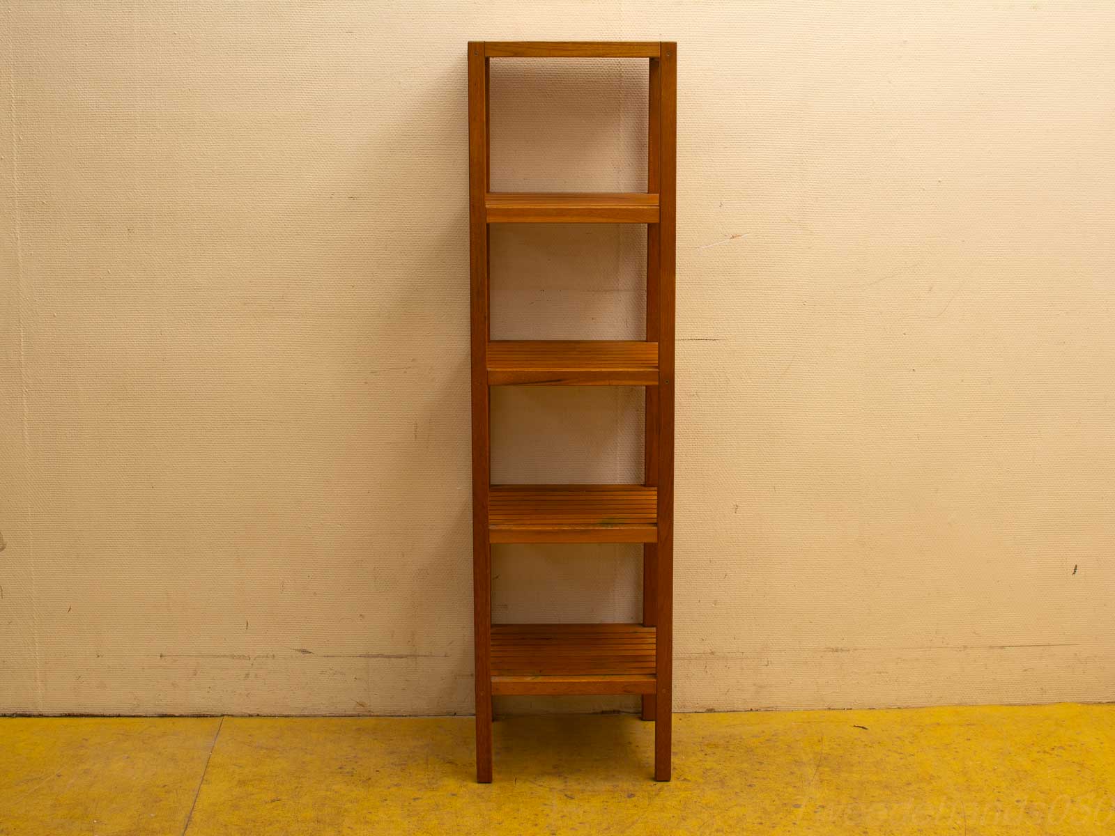 Elegant wooden shelf unit for displaying vintage treasures in any decor style.