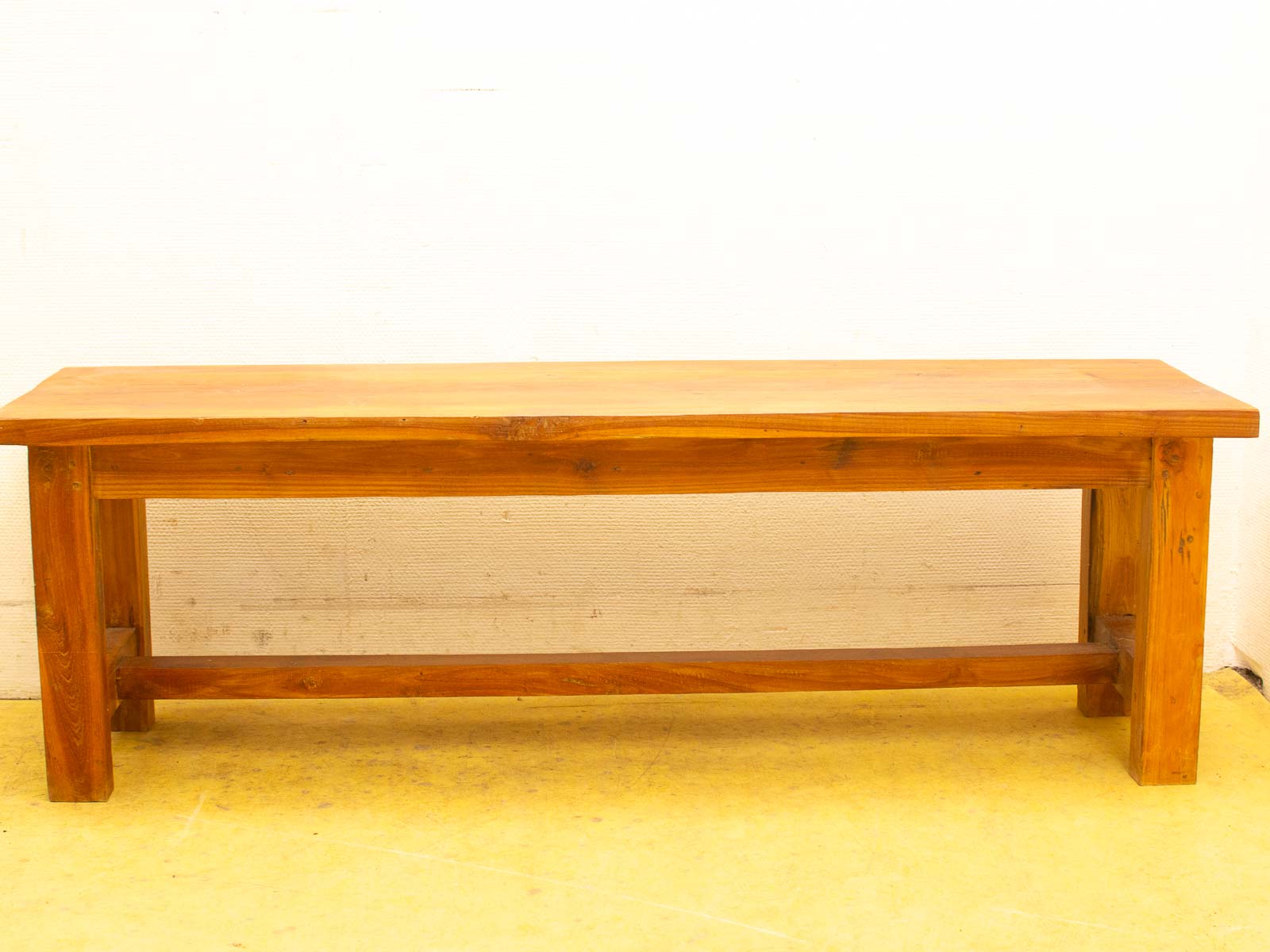 Elegant wooden bench with rustic charm, perfect for any indoor or outdoor space.