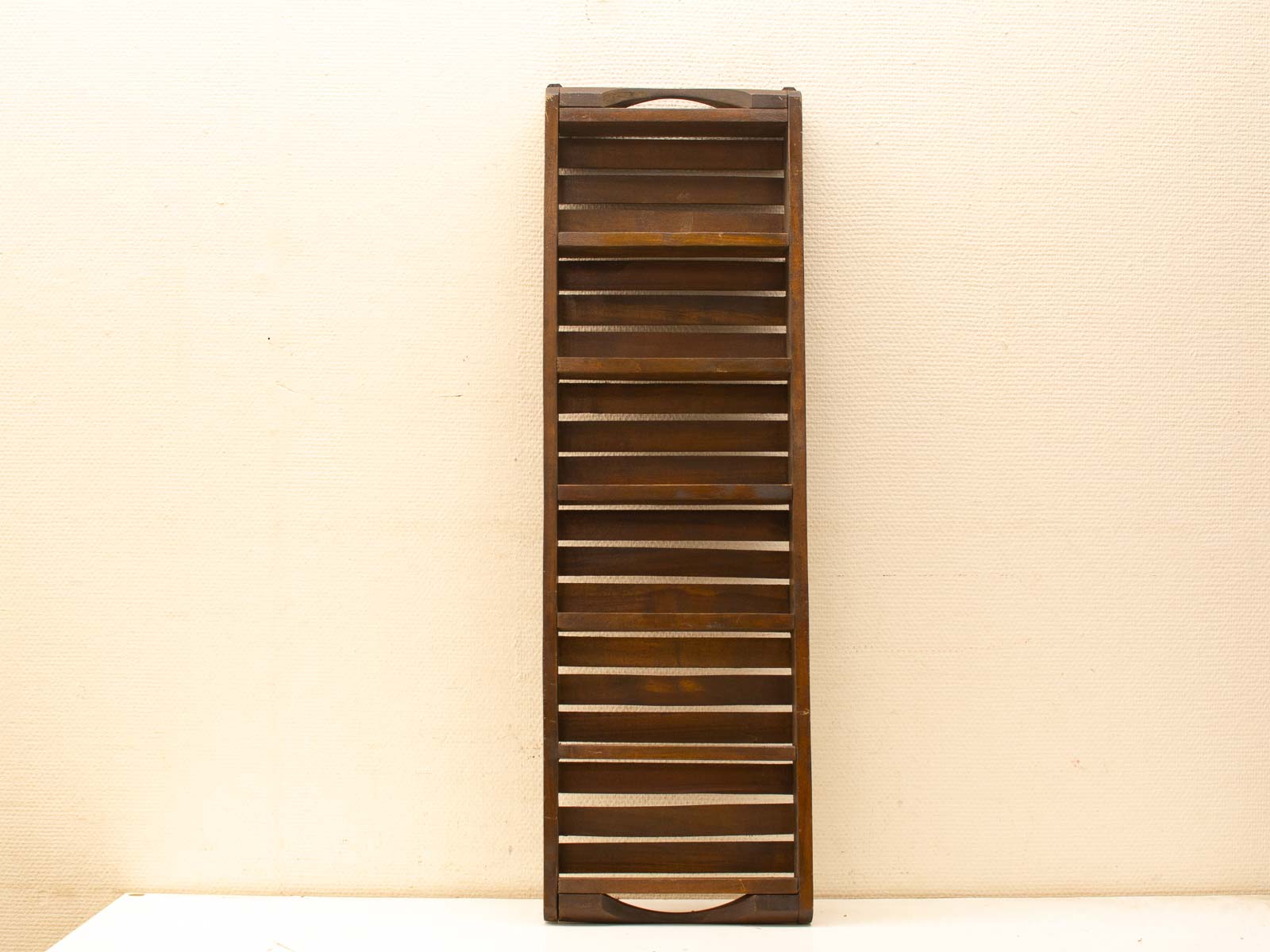 Elegant rustic wooden slatted rack, perfect for displaying decor in any home setting.