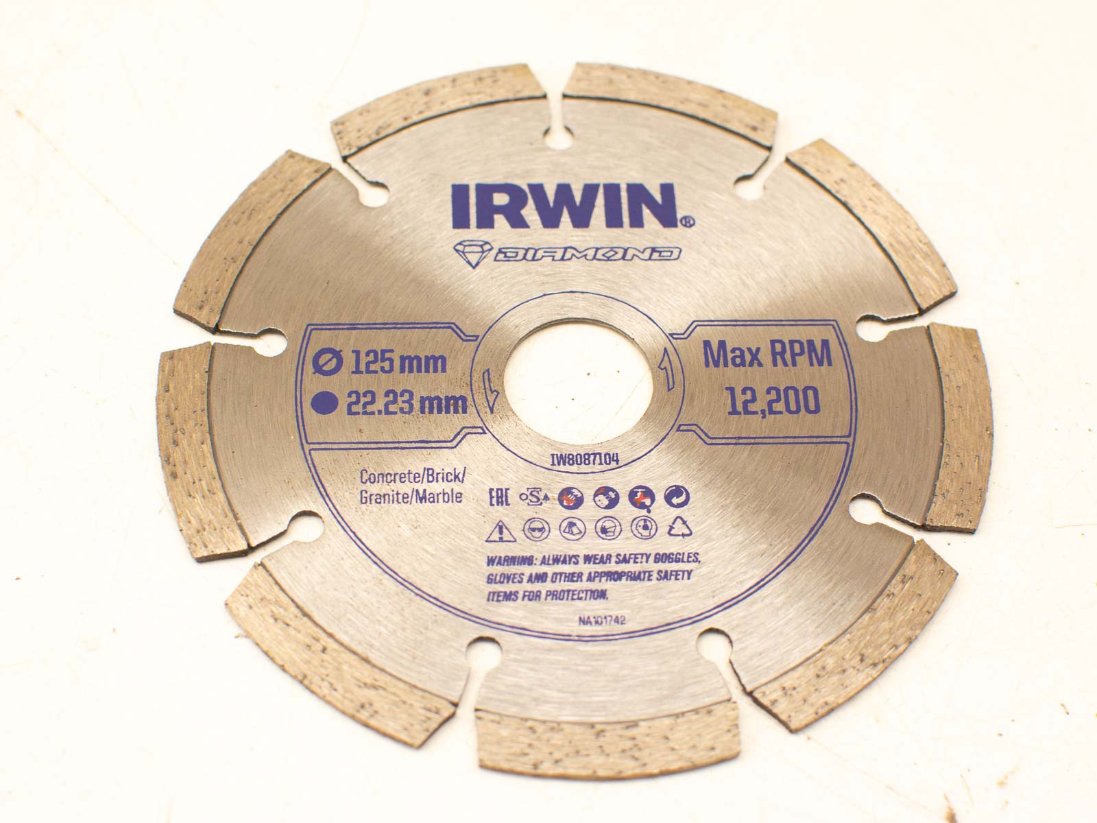 Irwin 125mm diamond blade for cutting concrete, granite, and brick with precision and safety.