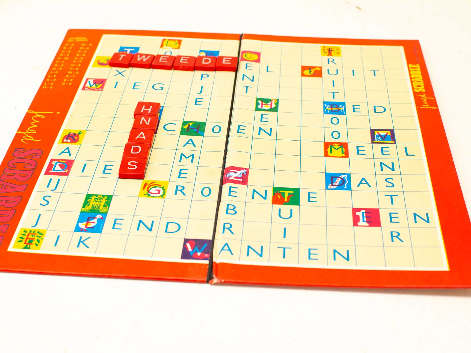 Colorful Scrabble board game: vibrant tiles, playful design, and strategic word play for family fun.