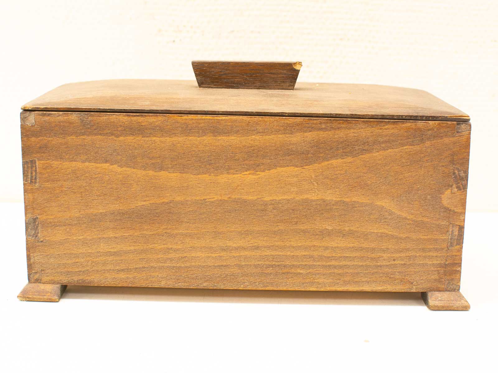 Handcrafted rustic wooden storage box showcasing traditional craftsmanship and natural wood grain.