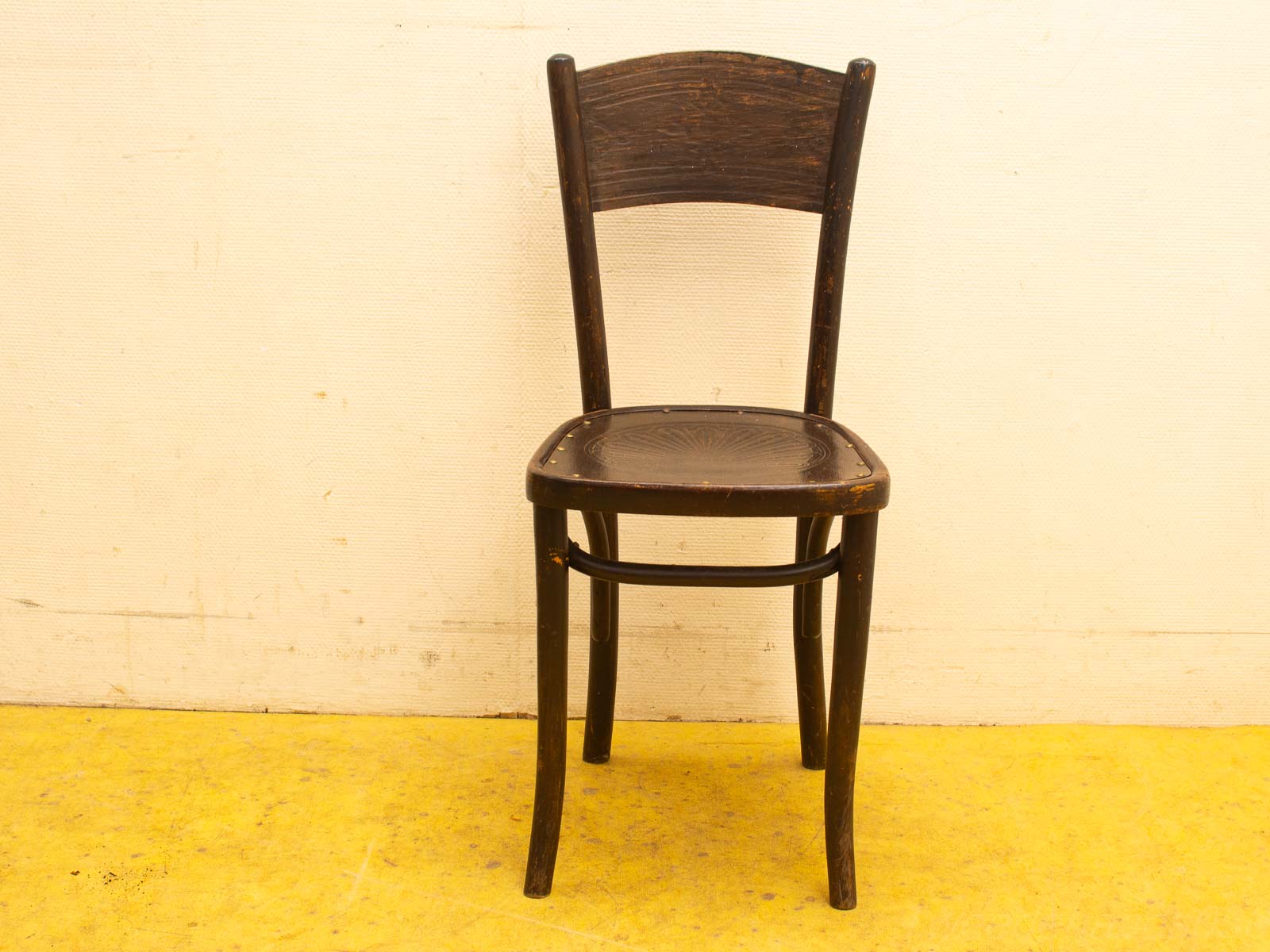 Elegant vintage wooden chair with intricate carvings and a rich brown finish, perfect for any space.