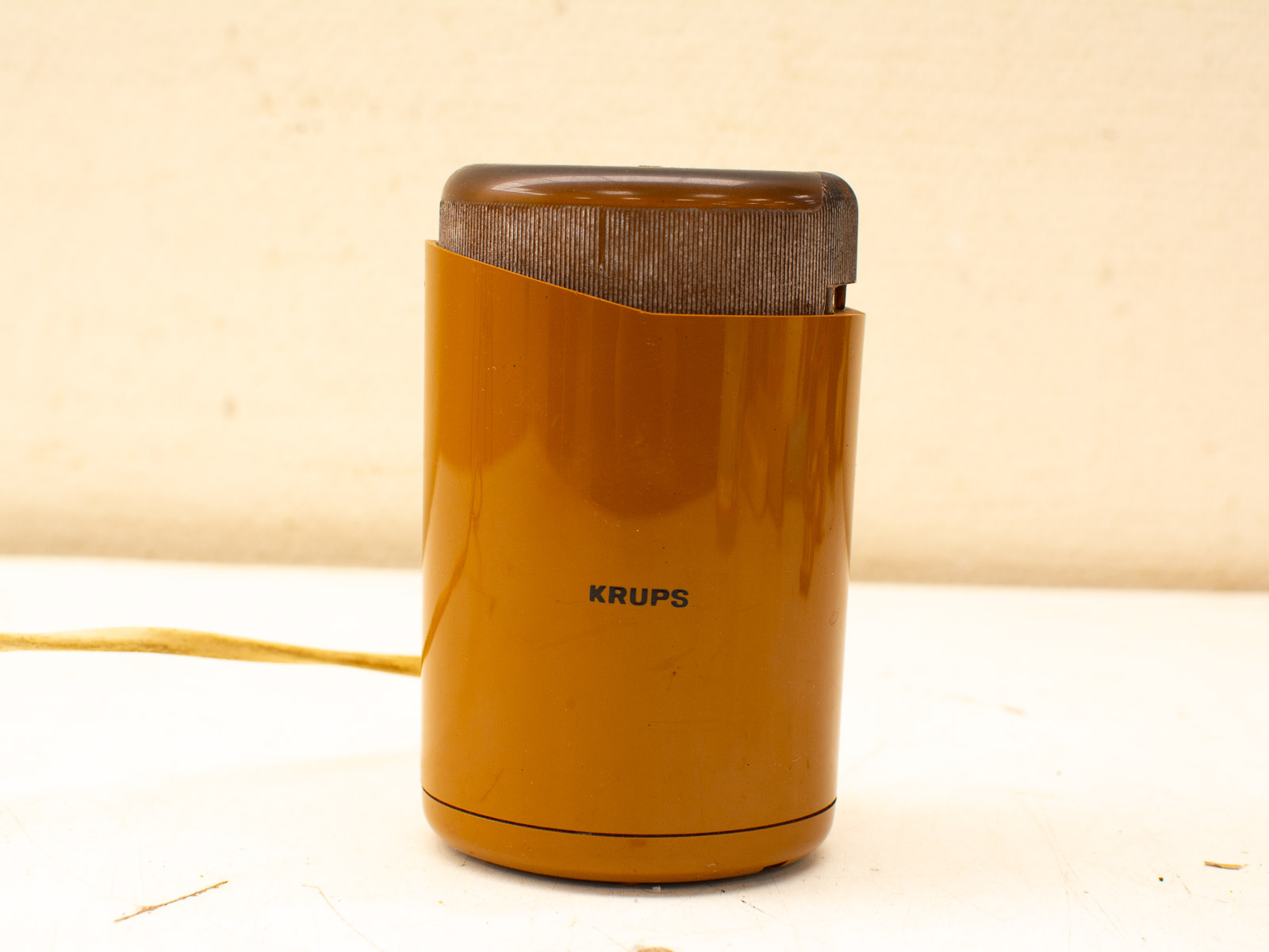 Vintage Krups coffee grinder in amber: a stylish and functional retro kitchen accessory.