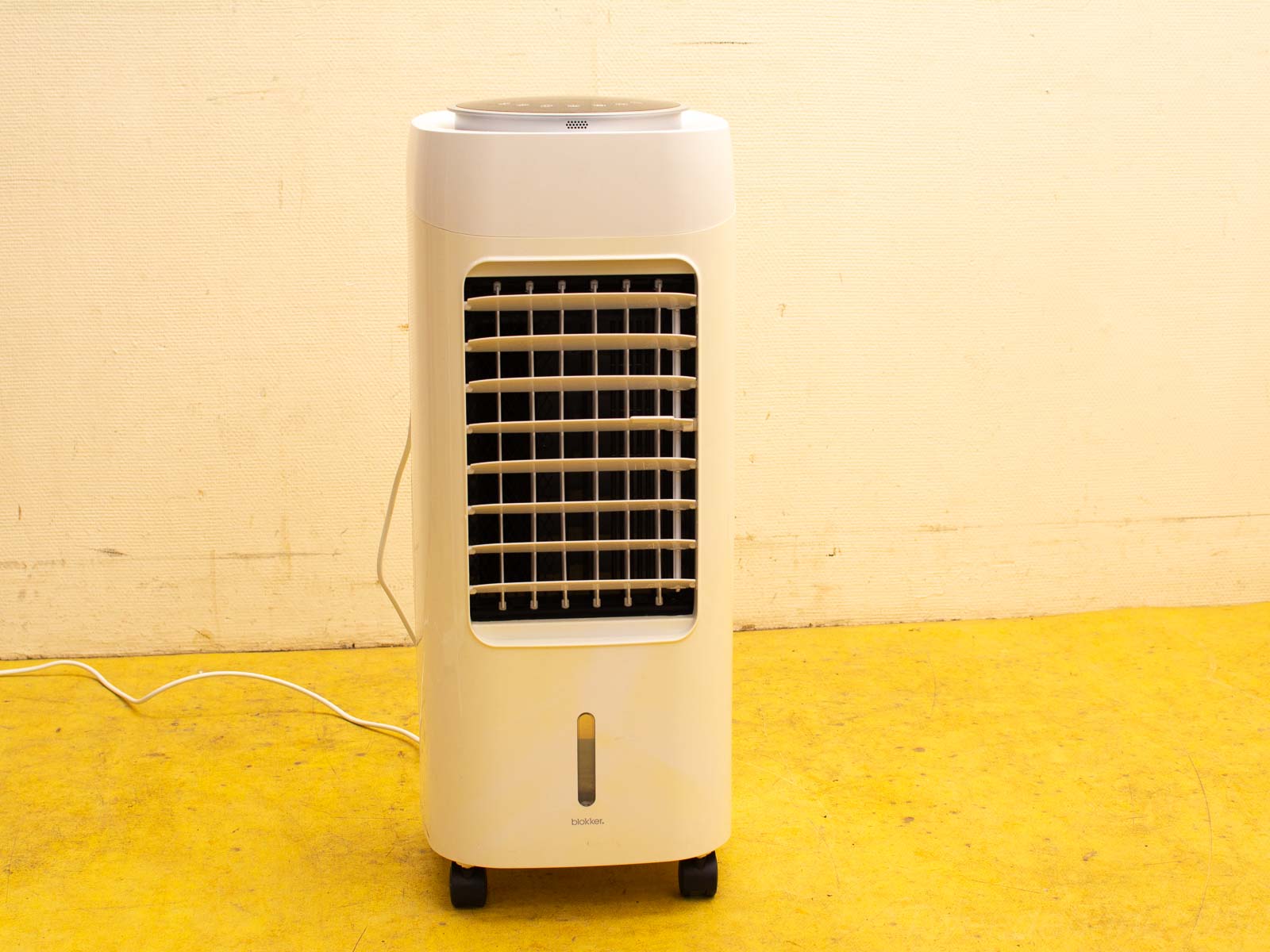 Stylish white portable air cooler for home use, efficient and easily movable on wheels.