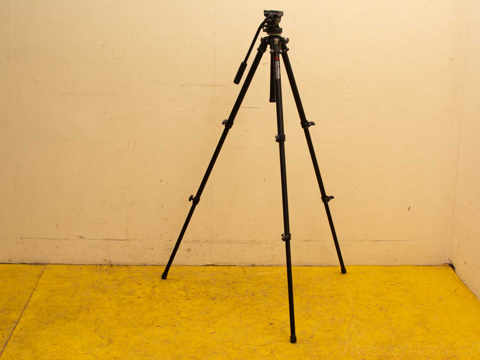 Sleek black tripod for professional cameras in a stylish and functional minimalist design.