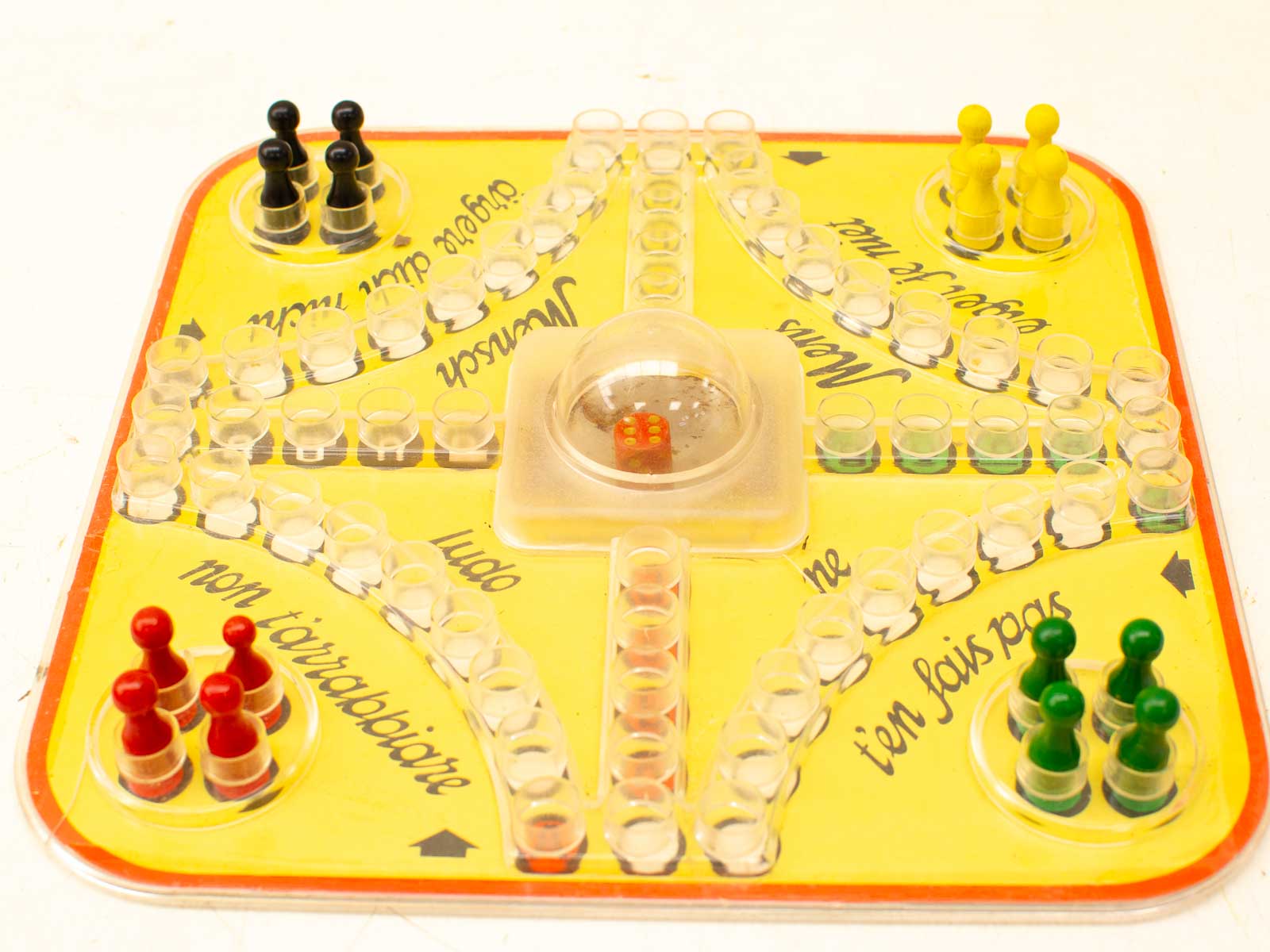 Colorful board game with dice, pawns, and playful instructions for a fun gameplay experience.