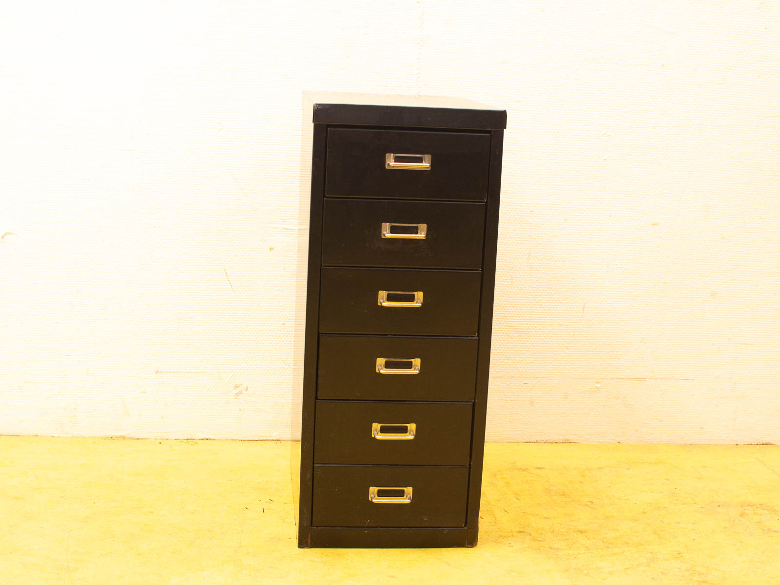 Sleek black filing cabinet with six drawers, perfect for stylish office organization.