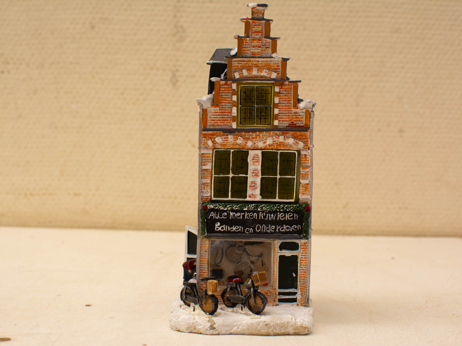 Charming Dutch bicycle shop model with intricate architecture and vintage bicycles, celebrating cycling heritage.