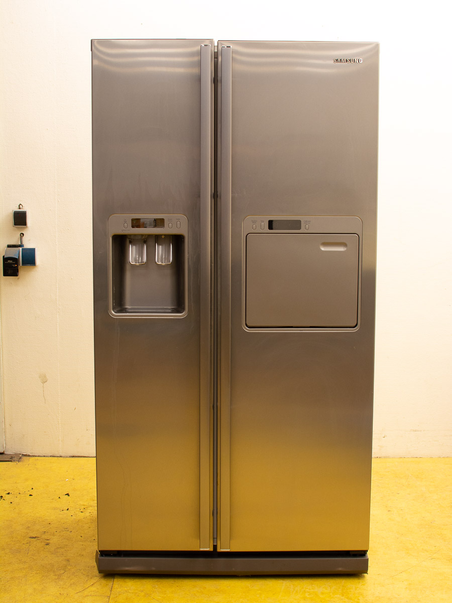 Sleek stainless steel refrigerator with ice dispenser, perfect for modern kitchen design and functionality.