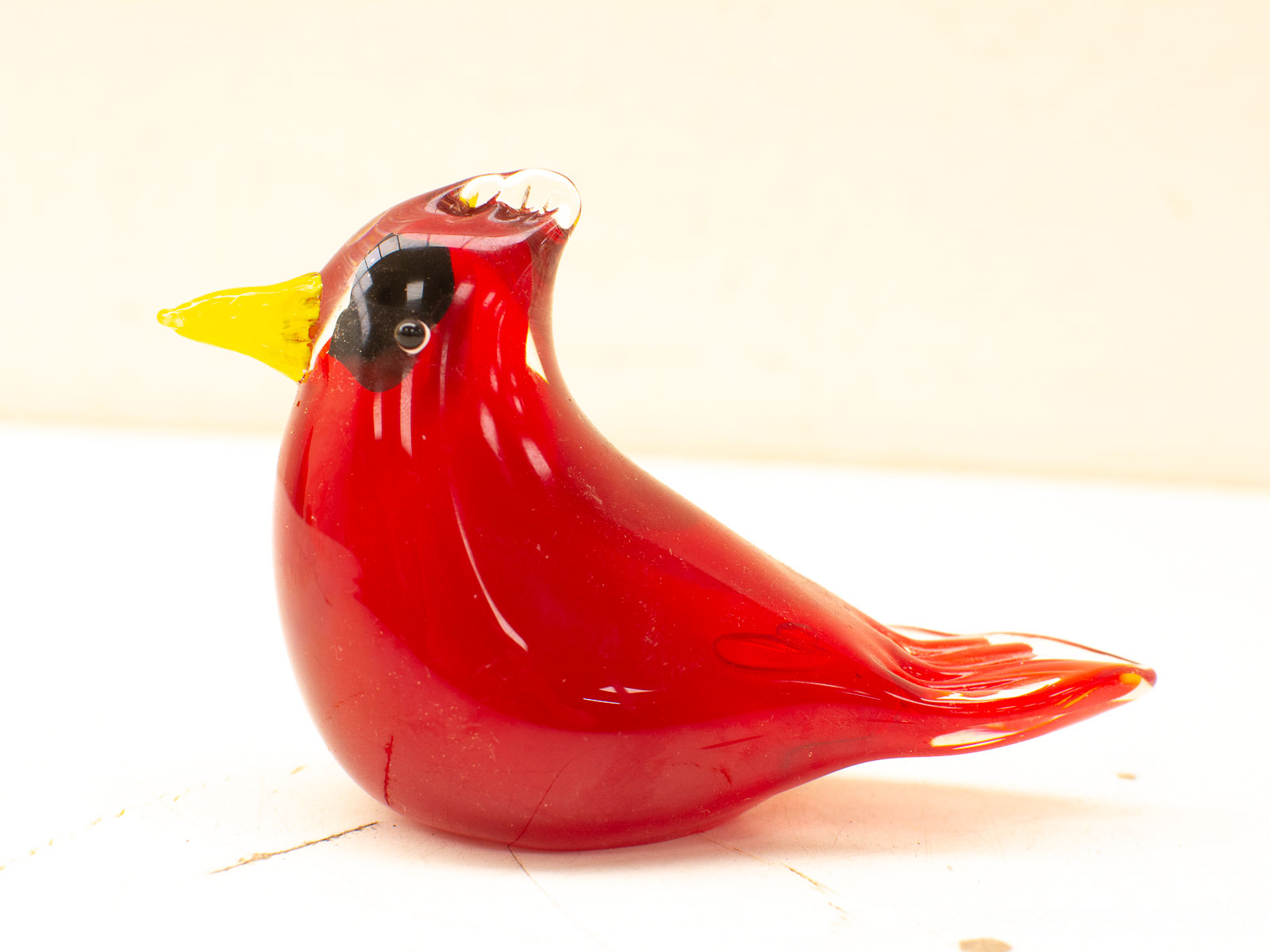 Handcrafted glass cardinal bird decoration, beautifully polished in vibrant red with contrasting yellow beak.