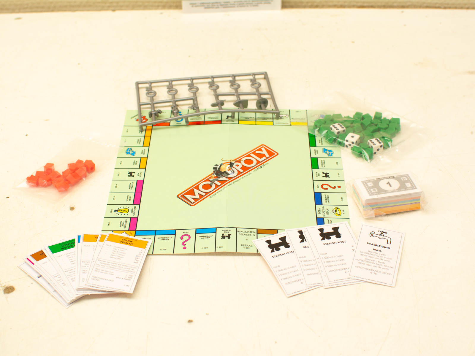 Vintage Monopoly game with colorful properties, tokens, houses, hotels, and money for classic fun.