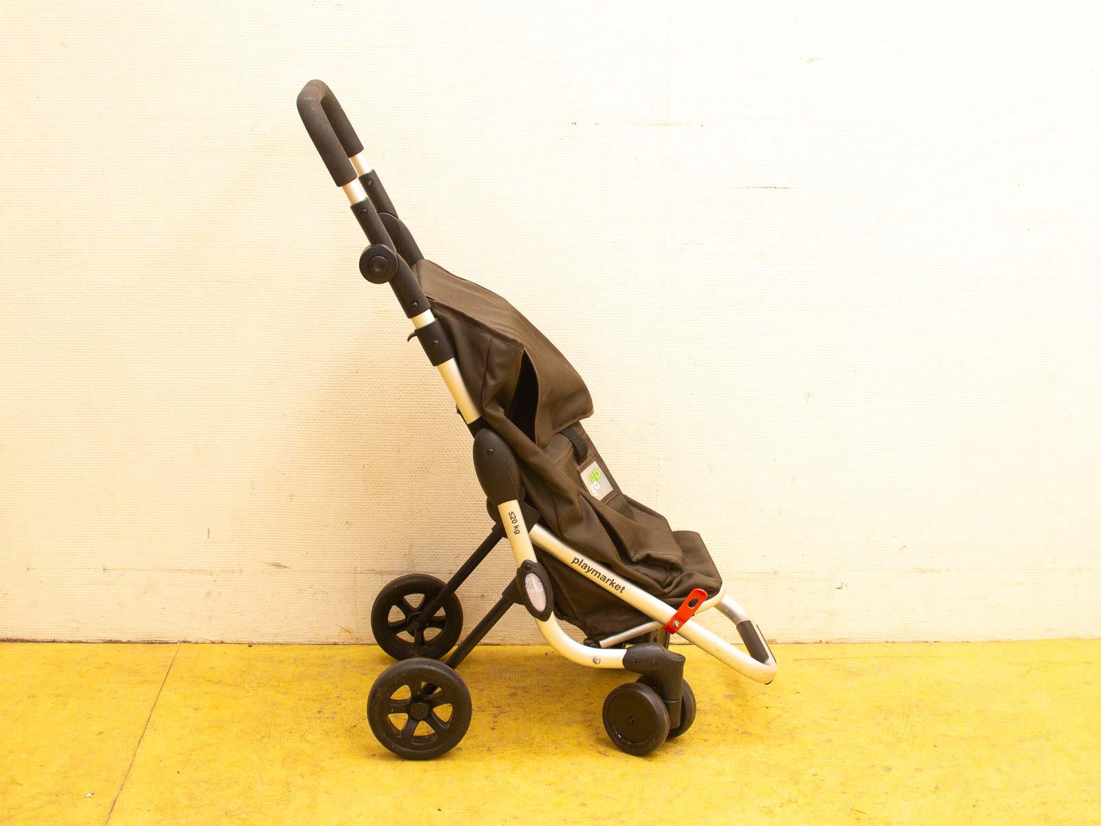 Lightweight modern dark brown baby stroller with ergonomic design and durable aluminum frame.