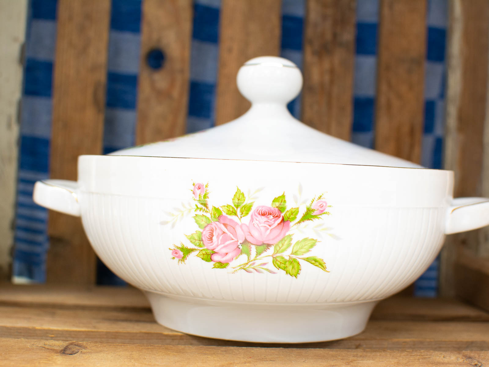 Vintage white porcelain serving dish with pink roses, perfect for elegant dining decor.