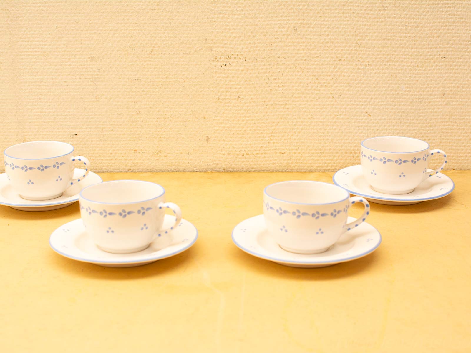 Charming vintage porcelain tea set with blue accents, perfect for elegant gatherings and afternoon tea.