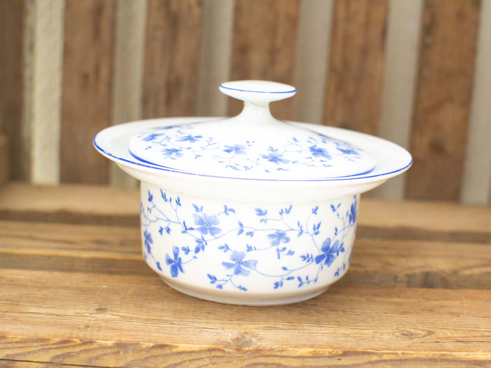 Elegant vintage porcelain tureen with blue floral patterns, perfect for dining and decor.