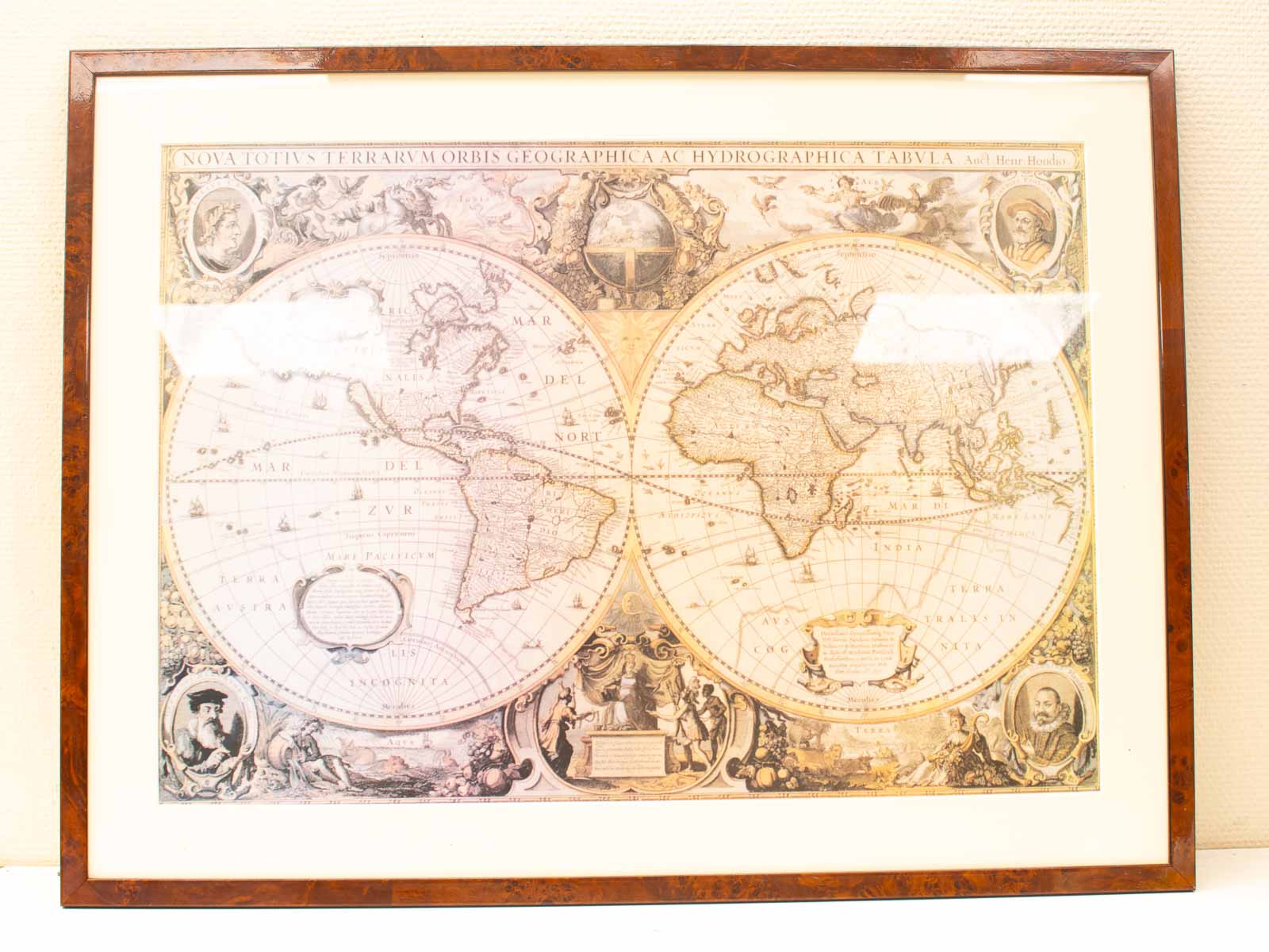 Stunning 17th-century world map, beautifully framed, blending art and history in cartographic design.