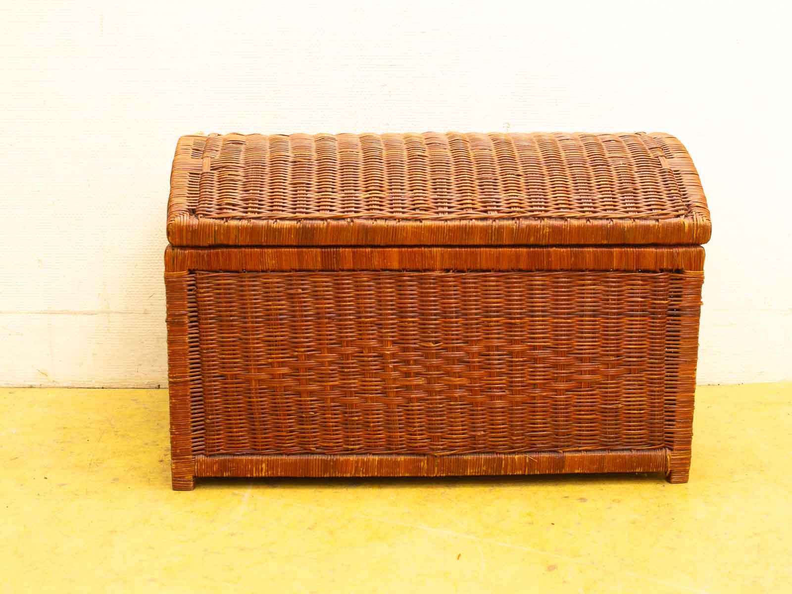 Elegant brown wicker storage chest, perfect for adding rustic charm and functionality to any space.