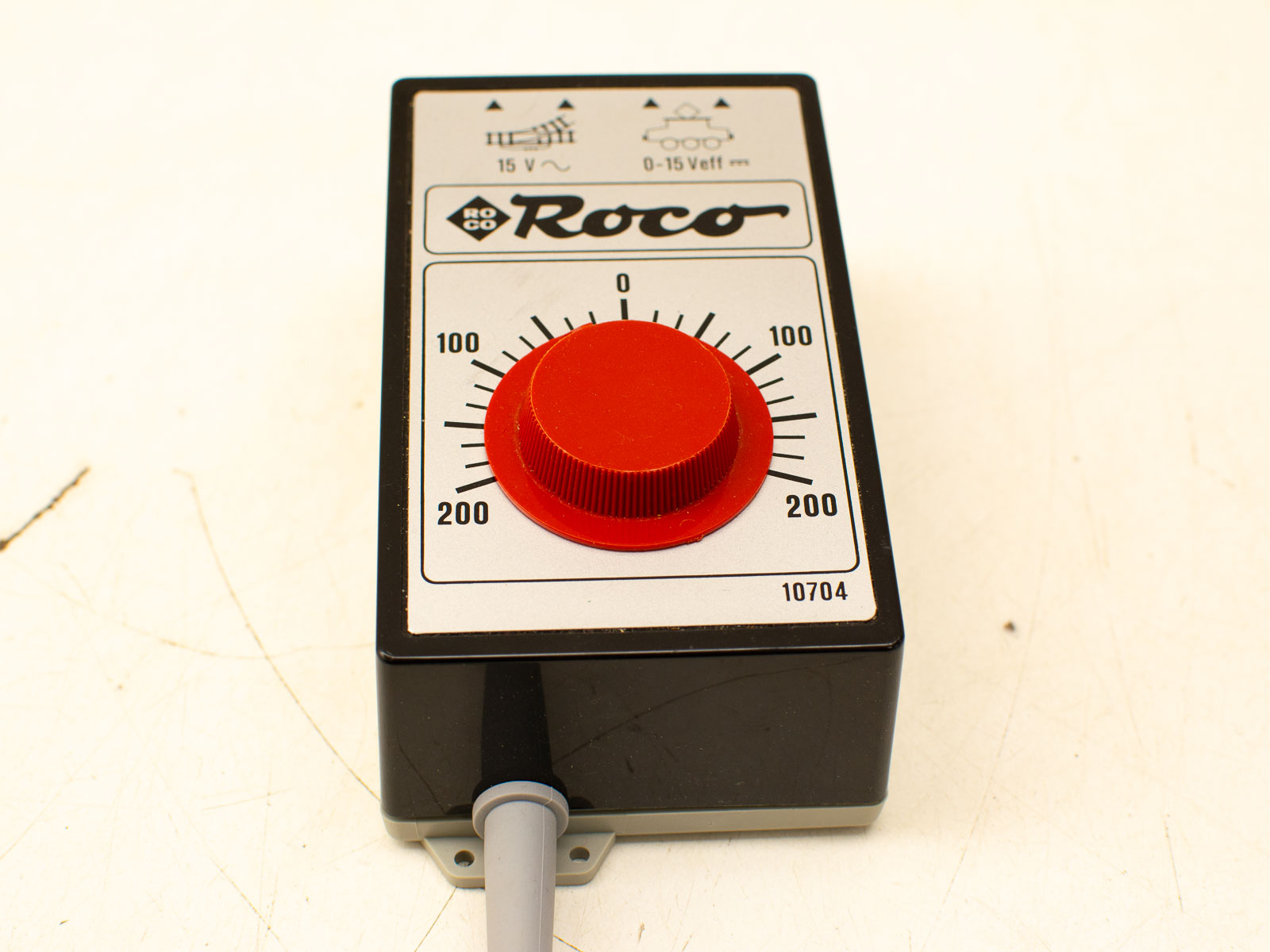 Roco model train control unit with red knob, user-friendly design for easy voltage adjustment.