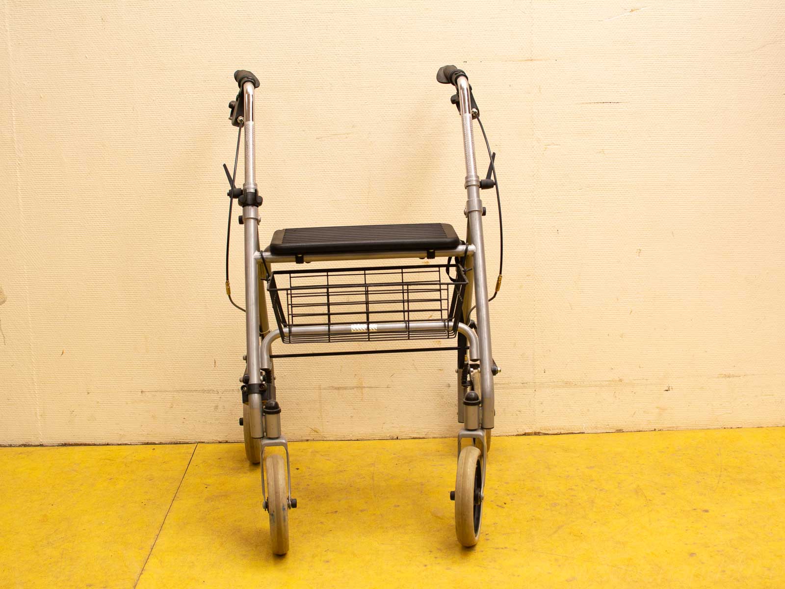 User-friendly Metal Mobility Walker with Cushioned Seat and Convenient Storage Basket