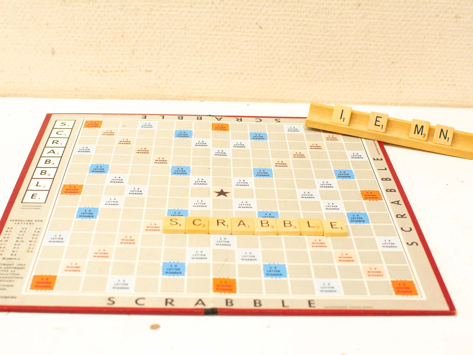 Classic Scrabble game with wooden tiles, vibrant board, and strategic wordplay action.