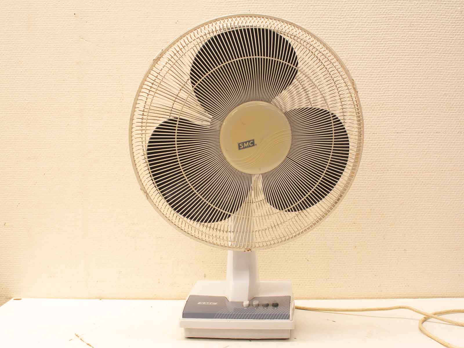 Classic standing fan with three blades for efficient cooling in any indoor space.