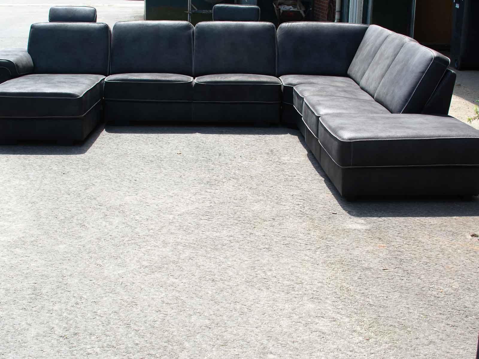 Stylish dark gray outdoor sectional sofa designed for comfort and versatile arrangements.