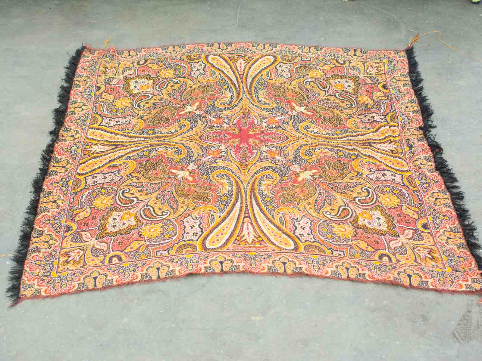 Vibrant vintage paisley shawl with elegant fringe, perfect for stylish layering and accessorizing.