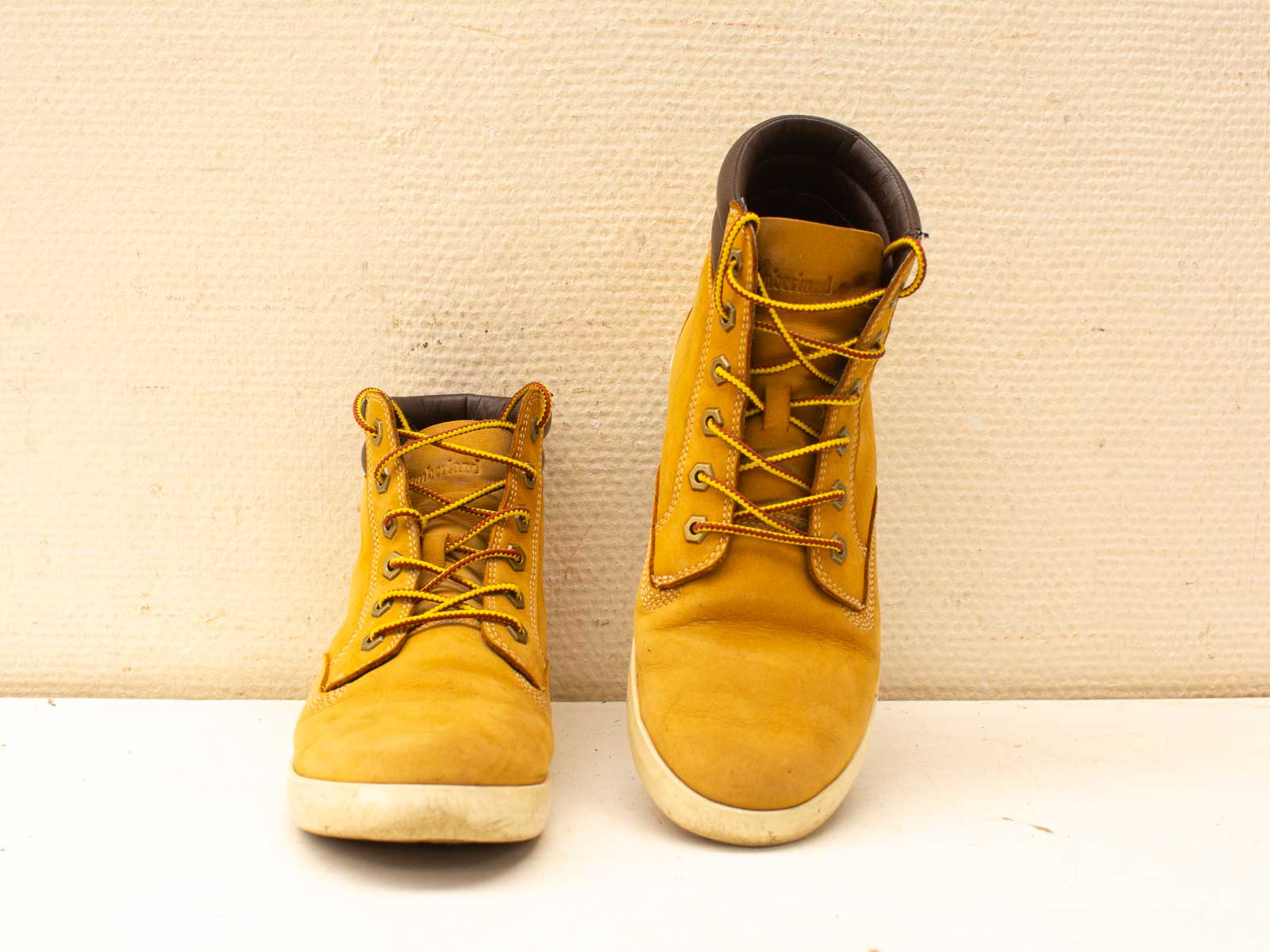 Stylish yellow vintage boots with rugged design, lace-up features, and durable comfort for urban adventures.