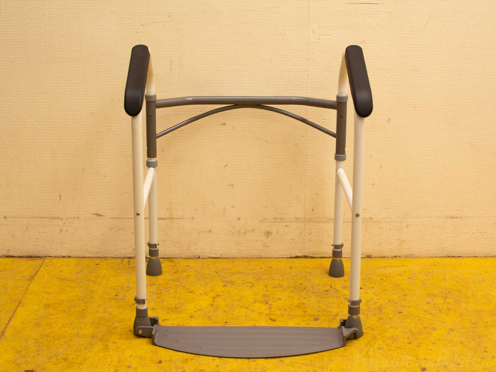 Lightweight vintage walker with padded grips for stability, safety, and enhanced mobility.