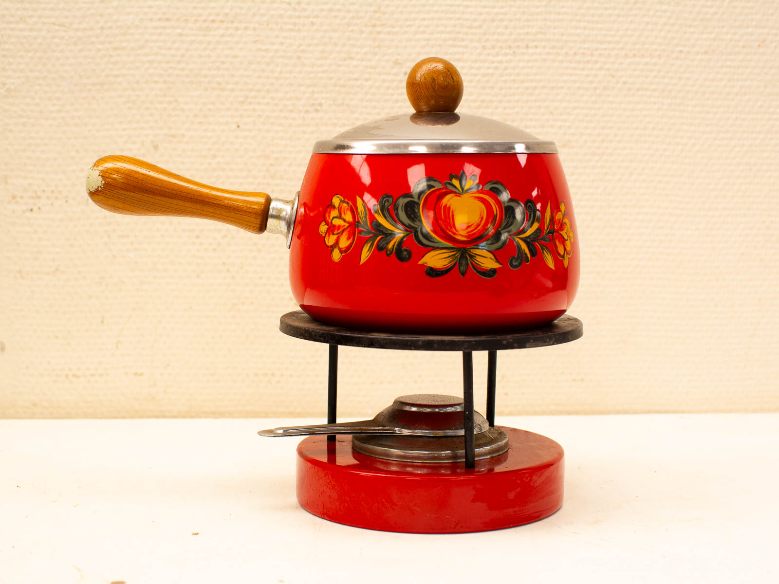 Traditional Red Floral Pot with Wooden Handle for Nostalgic Cooking and Serving