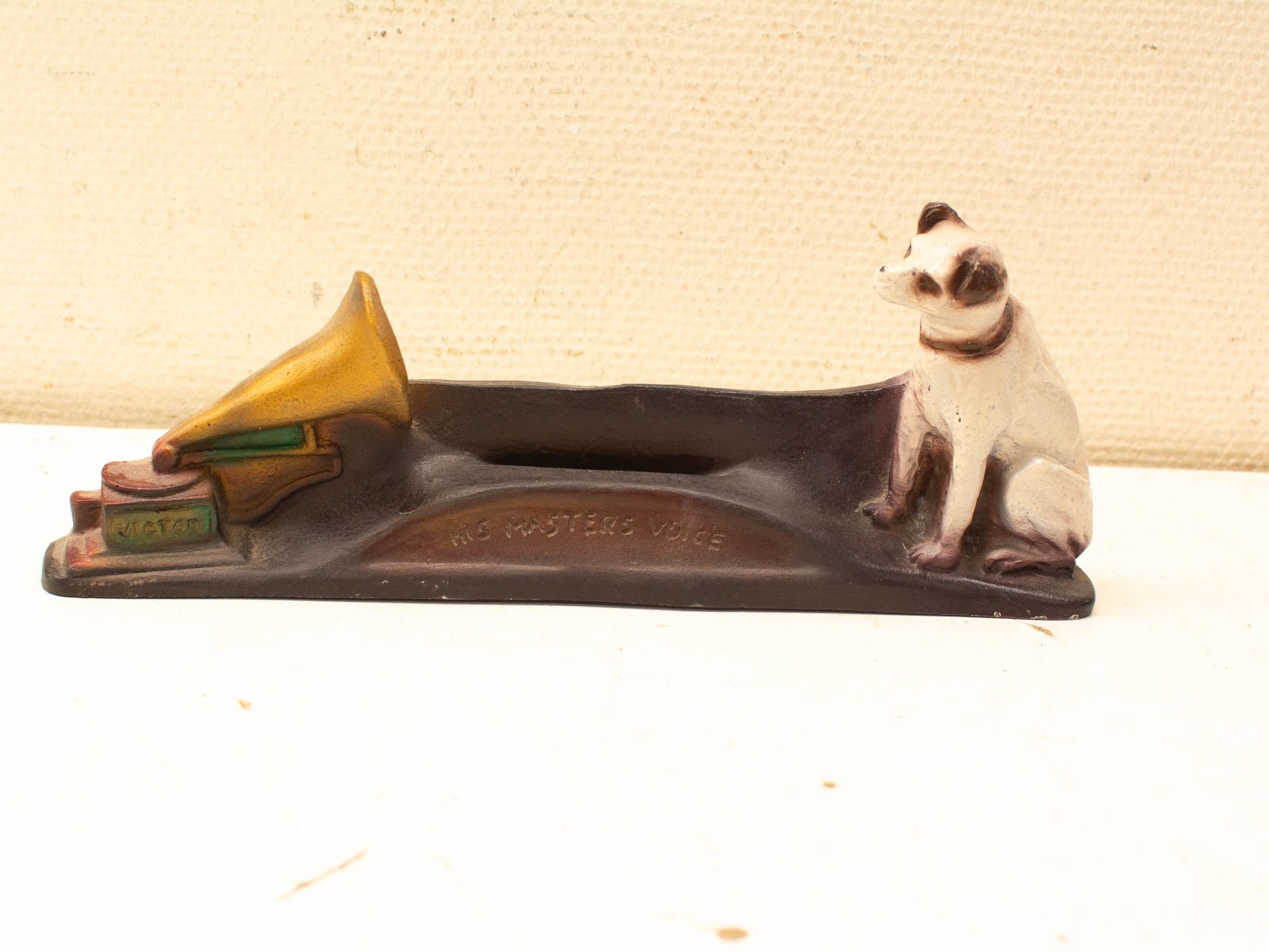 Vintage His Masters Voice dog figurine with phonograph, perfect for collectors and nostalgia lovers.